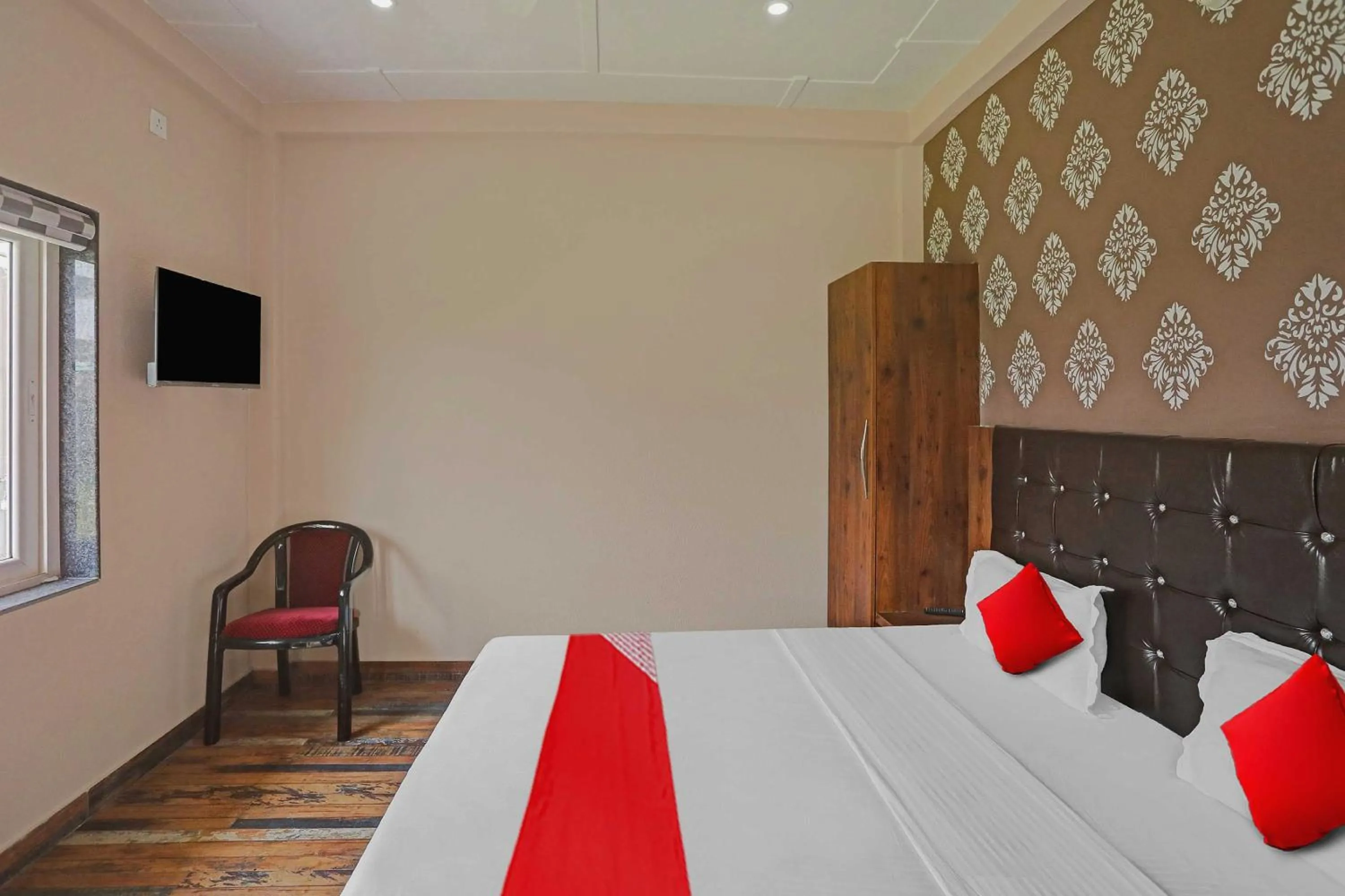 Bedroom in Hotel O MH Inn