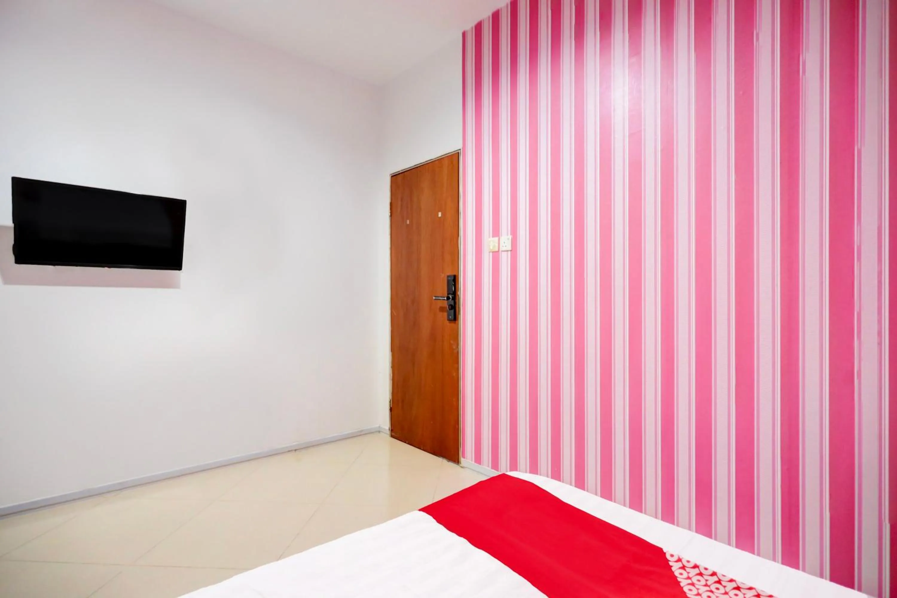 Bedroom in Hotel O Happy 777