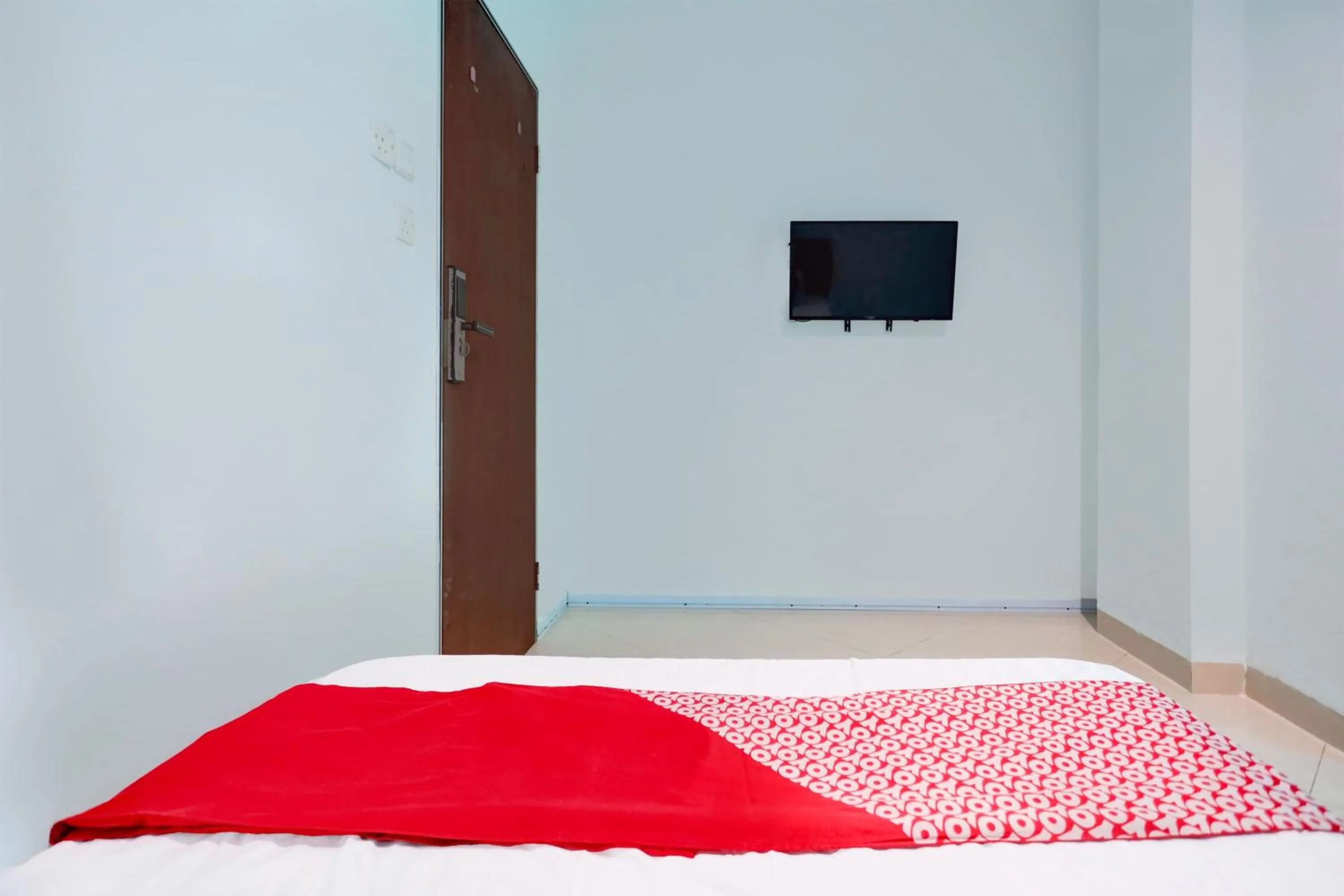 Bedroom in Hotel O Happy 777