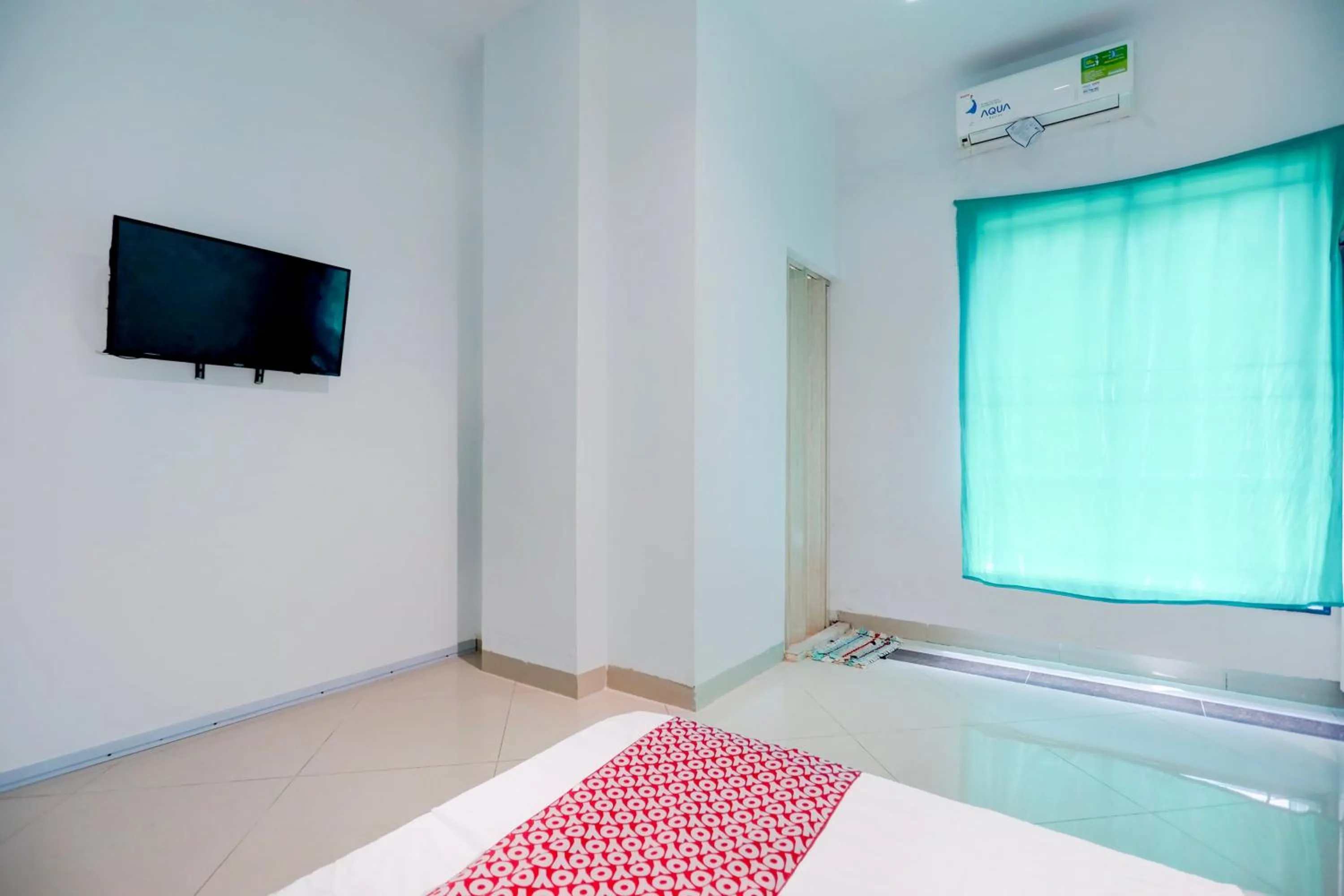 Bedroom in Hotel O Happy 777