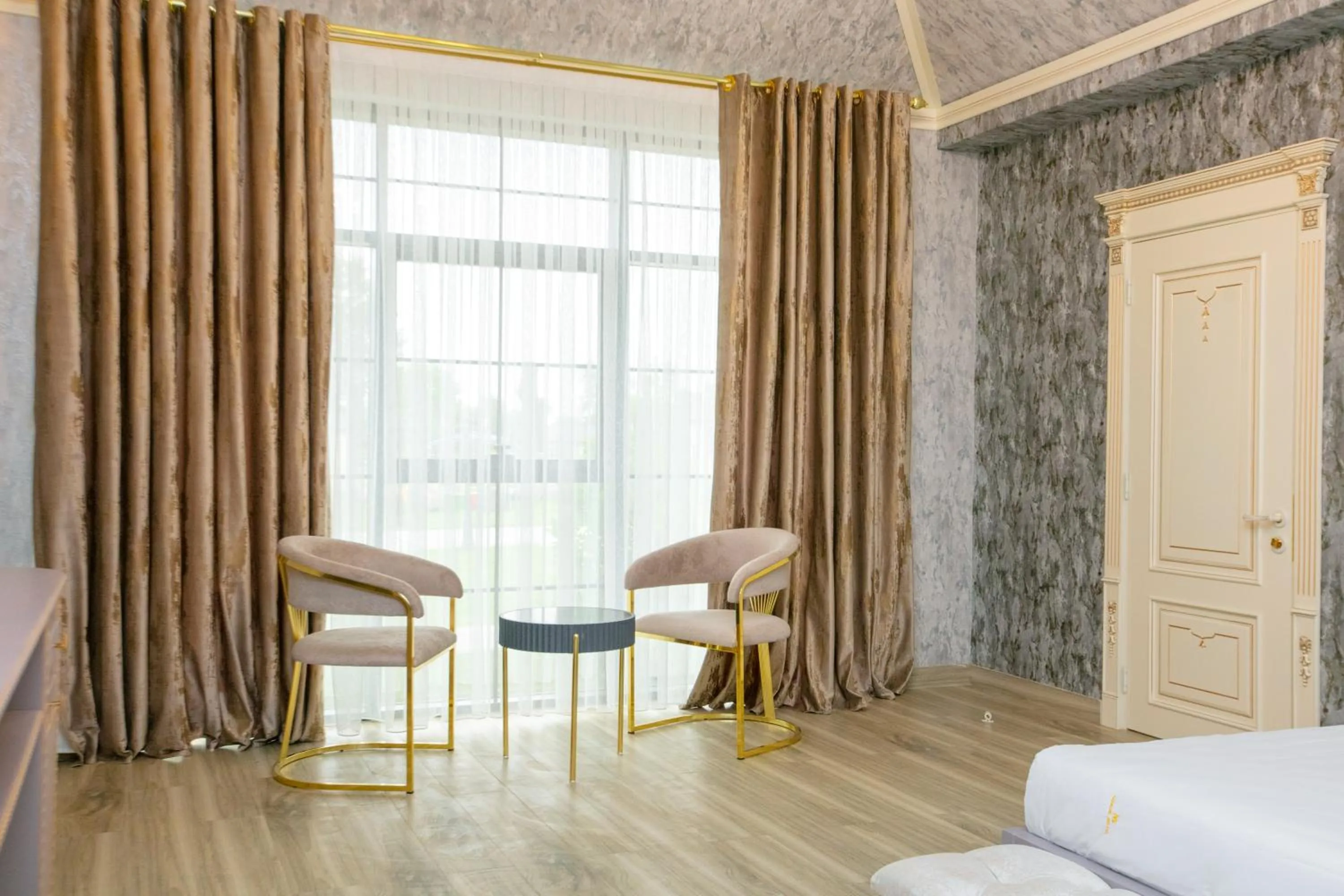 Seating area, Bed in Nohur Hotel Gabala