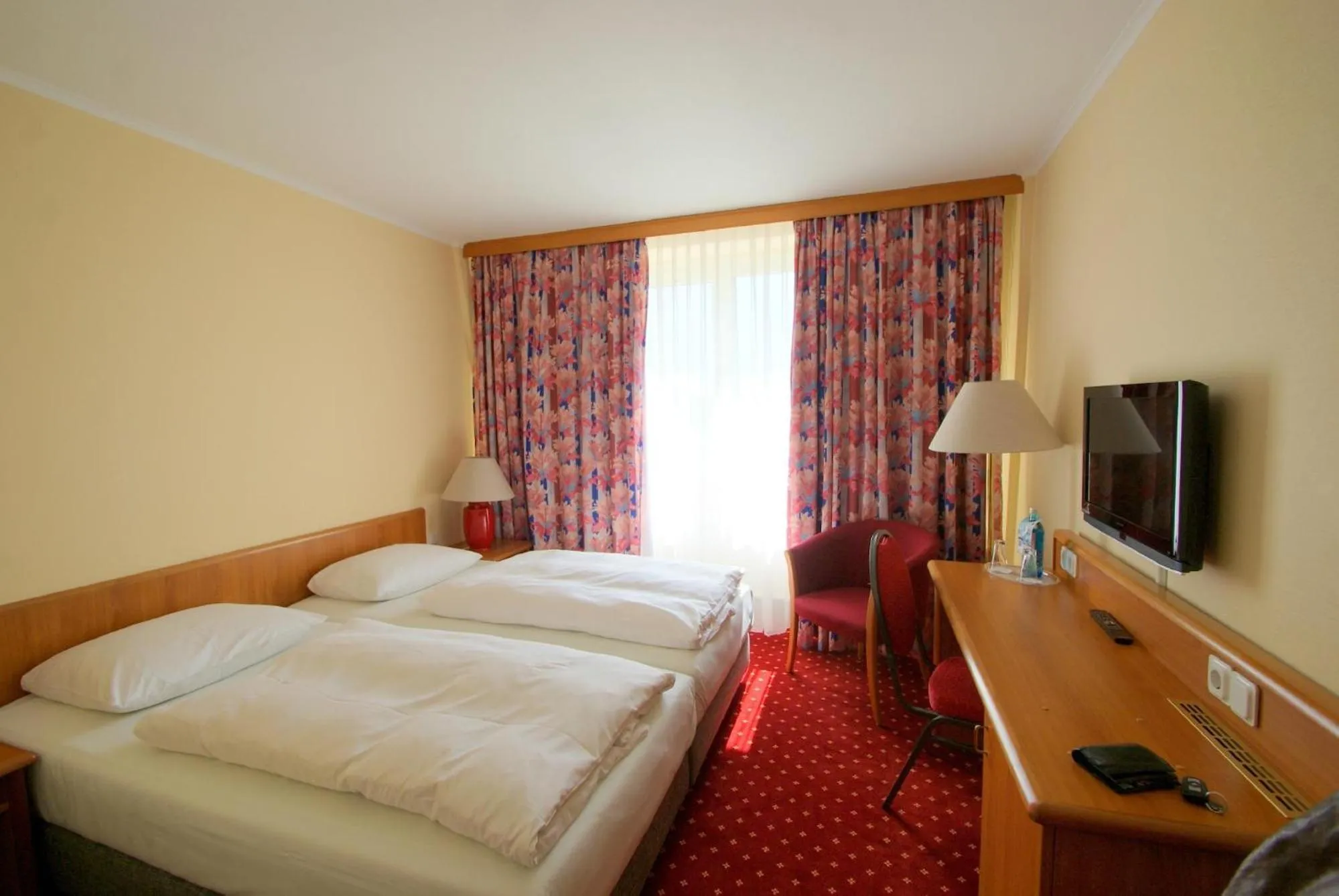 Photo of the whole room, Bed in Hotel Rosenstadt & Malxestube Restaurant