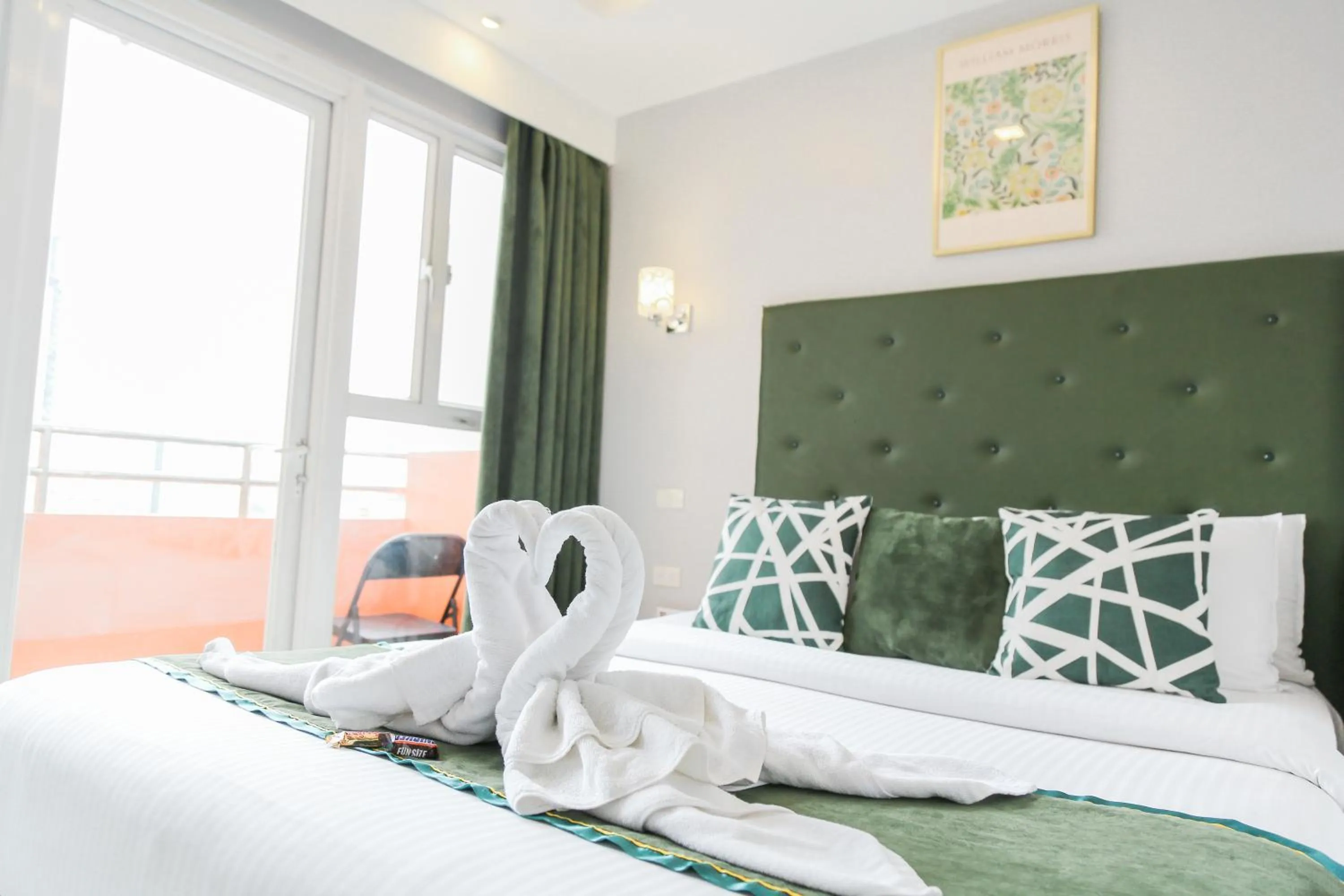 Bed in Pacific Bay Grand Suites