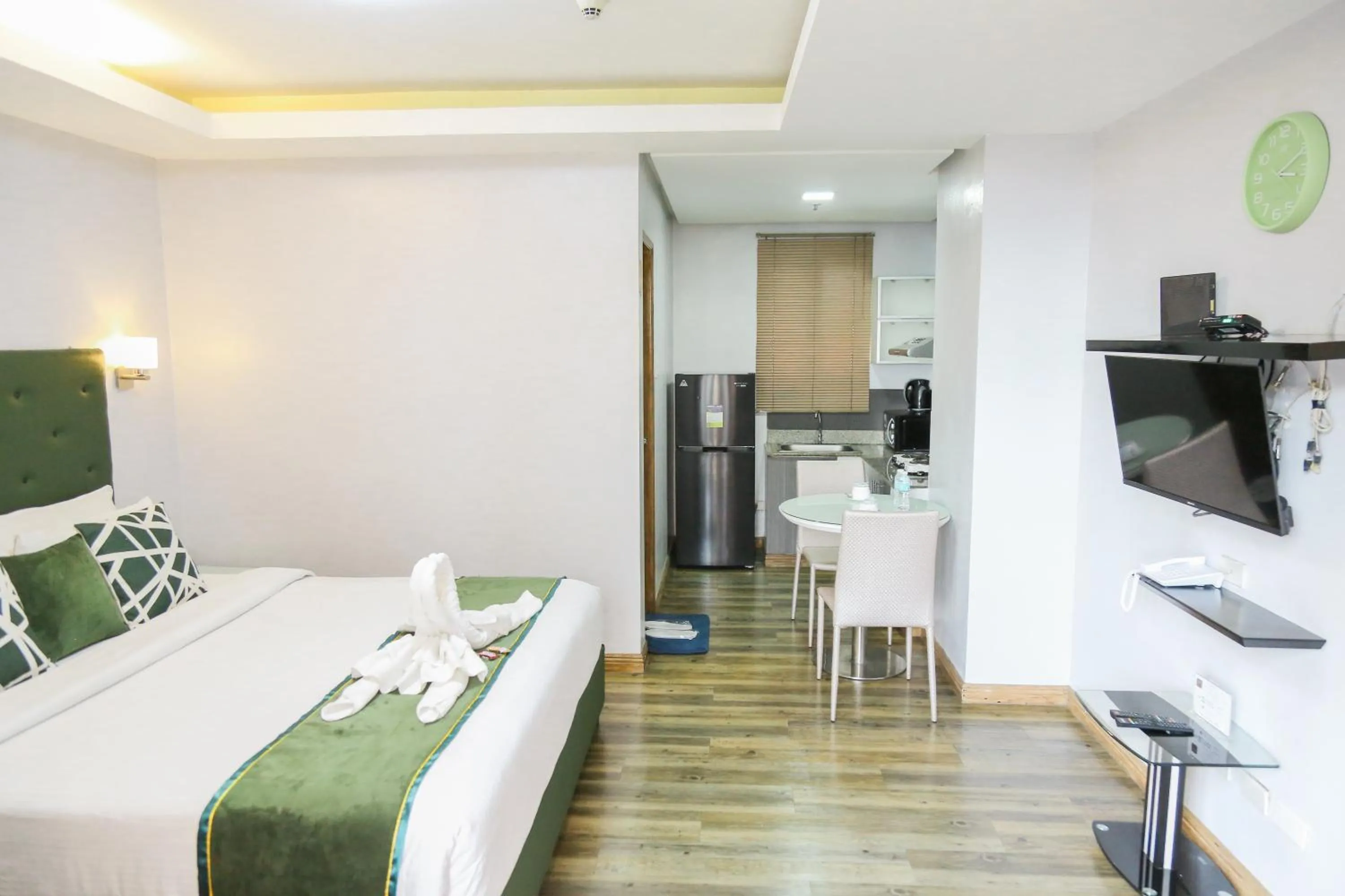 Bed in Pacific Bay Grand Suites