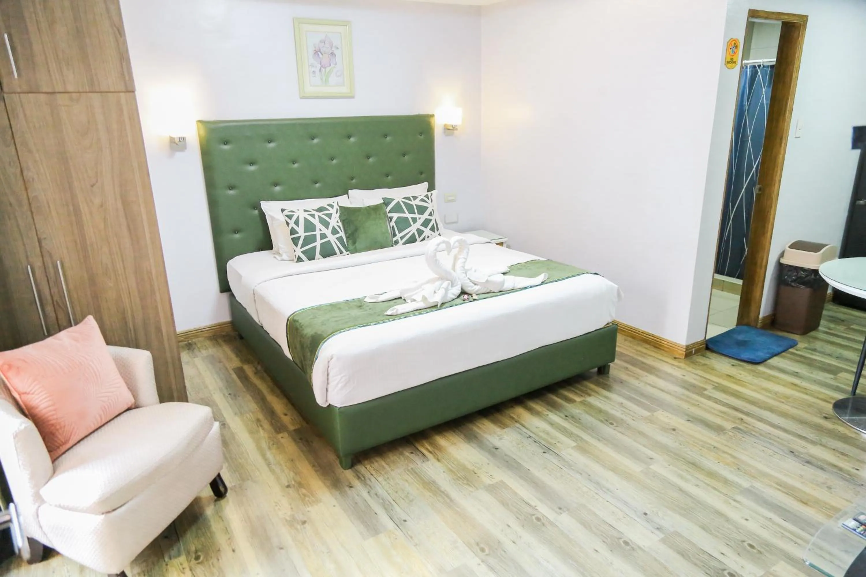 Bed in Pacific Bay Grand Suites