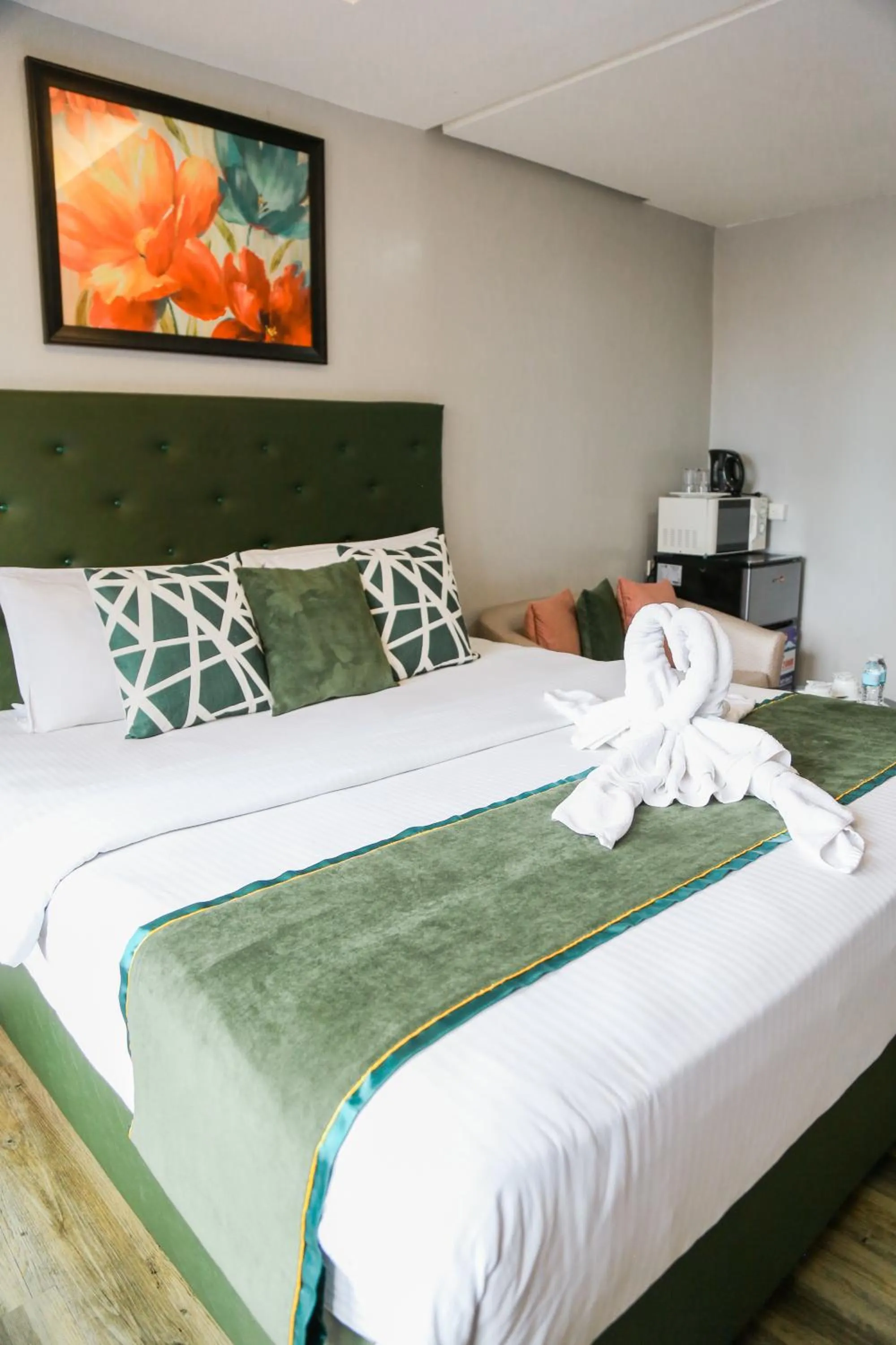 Bed in Pacific Bay Grand Suites