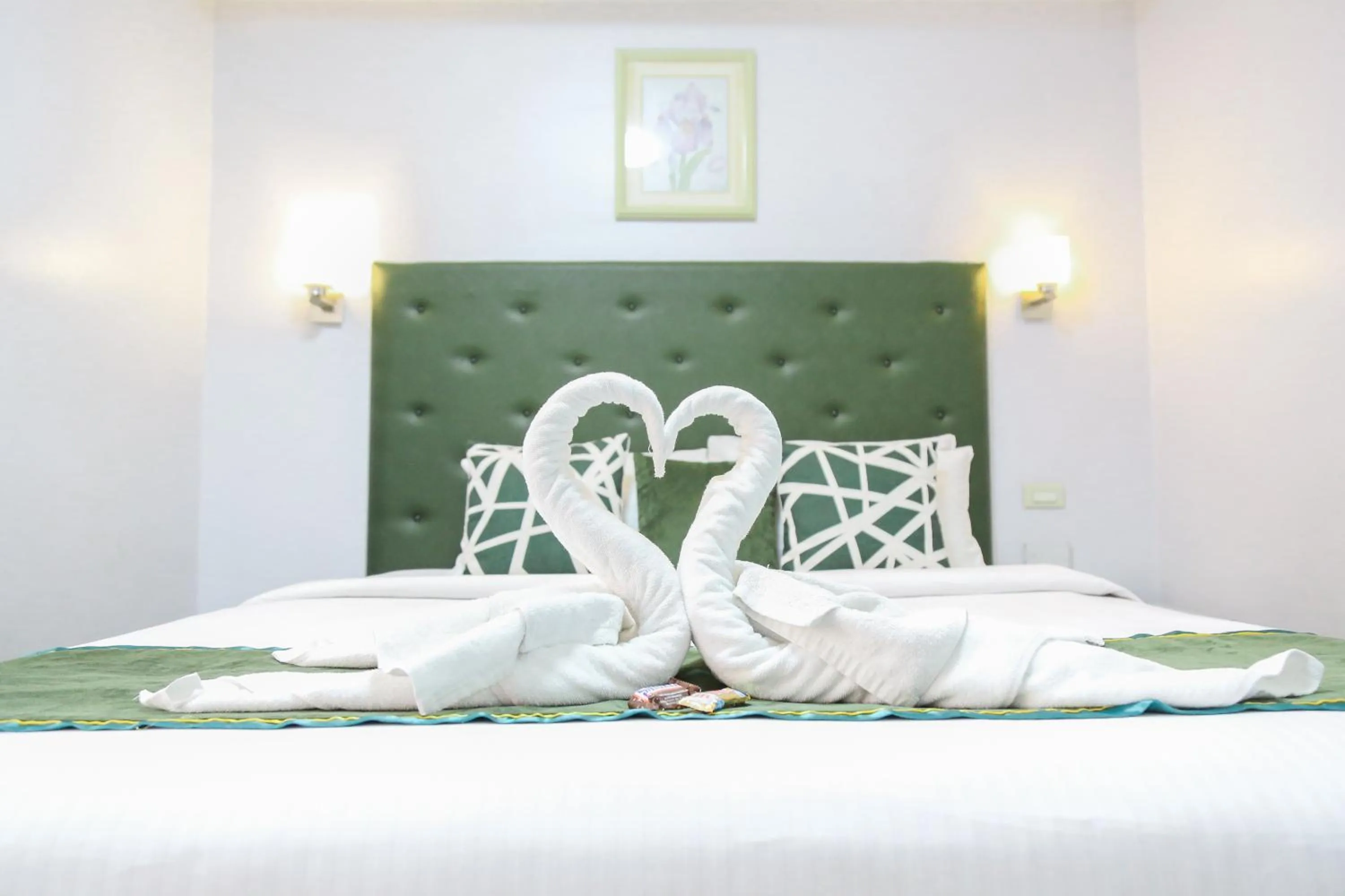 Bed in Pacific Bay Grand Suites