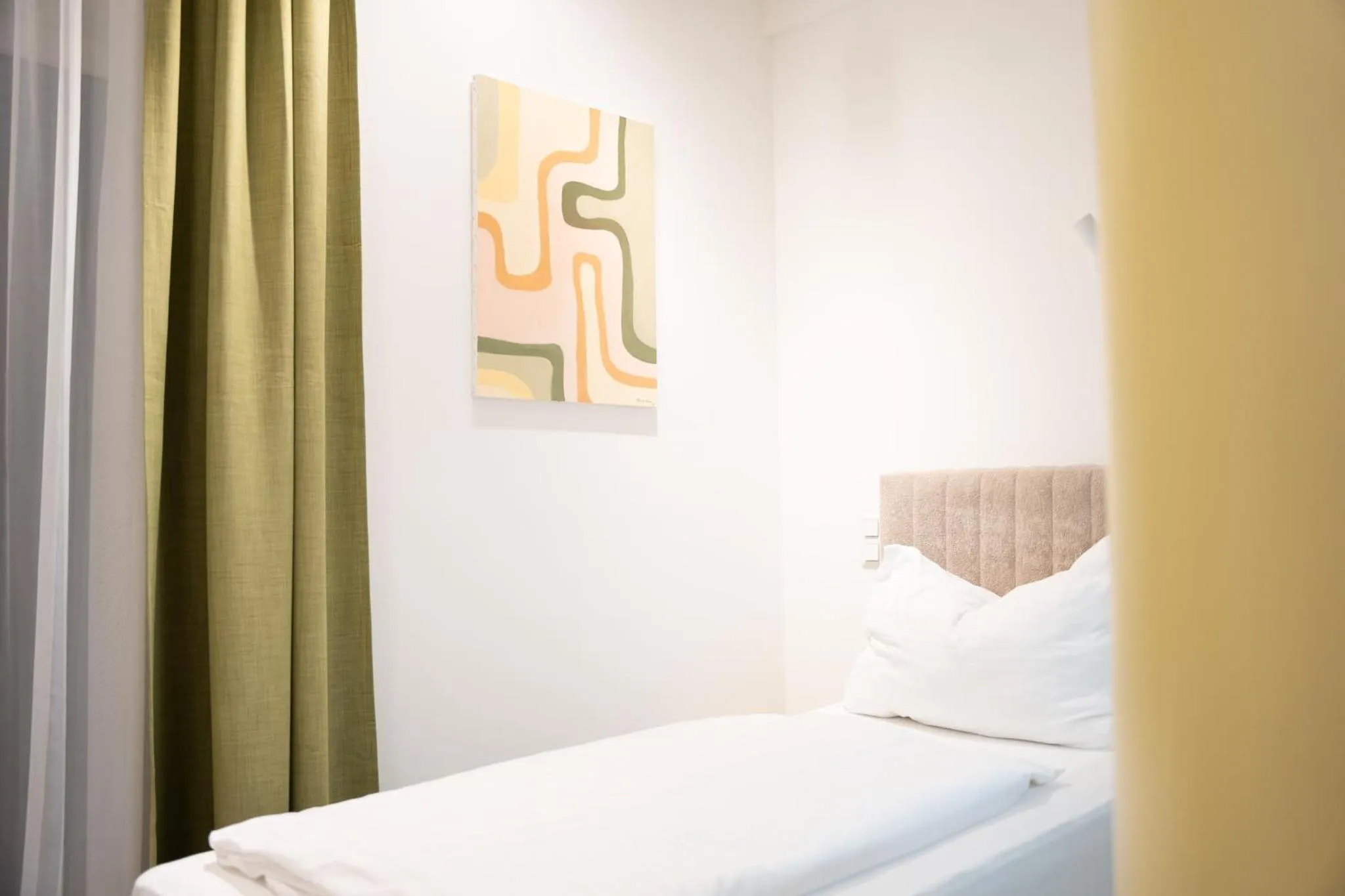 Bed in Primus Hotel & Apartments