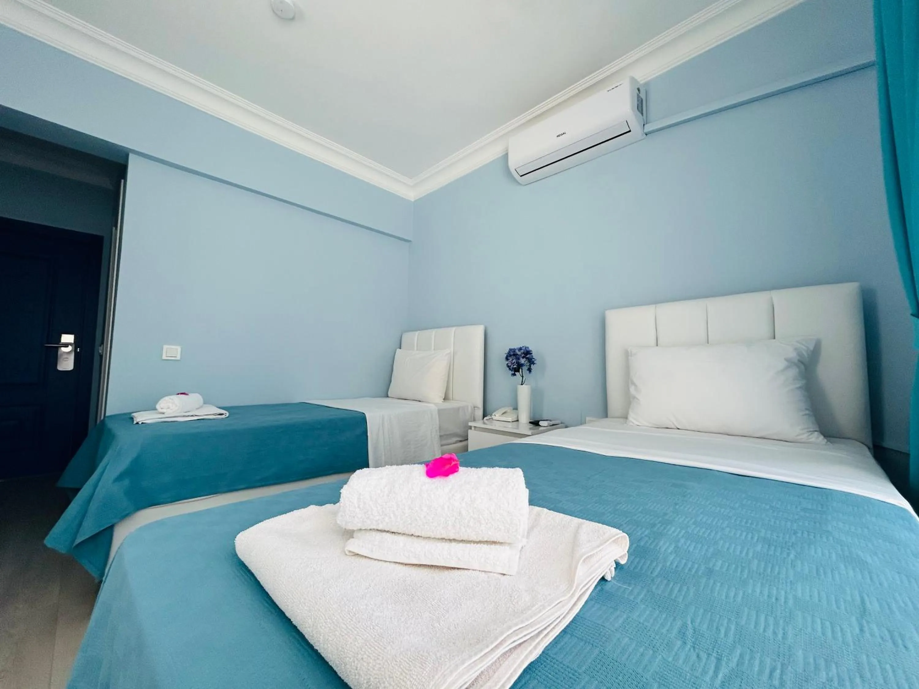 Bed in Marquis Blue Hotel