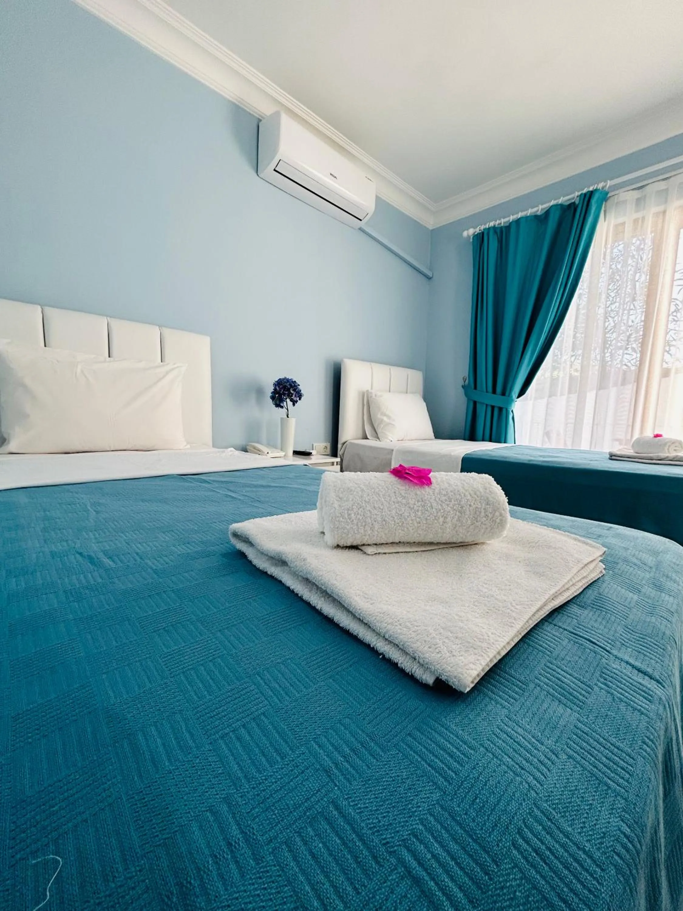 Bed in Marquis Blue Hotel