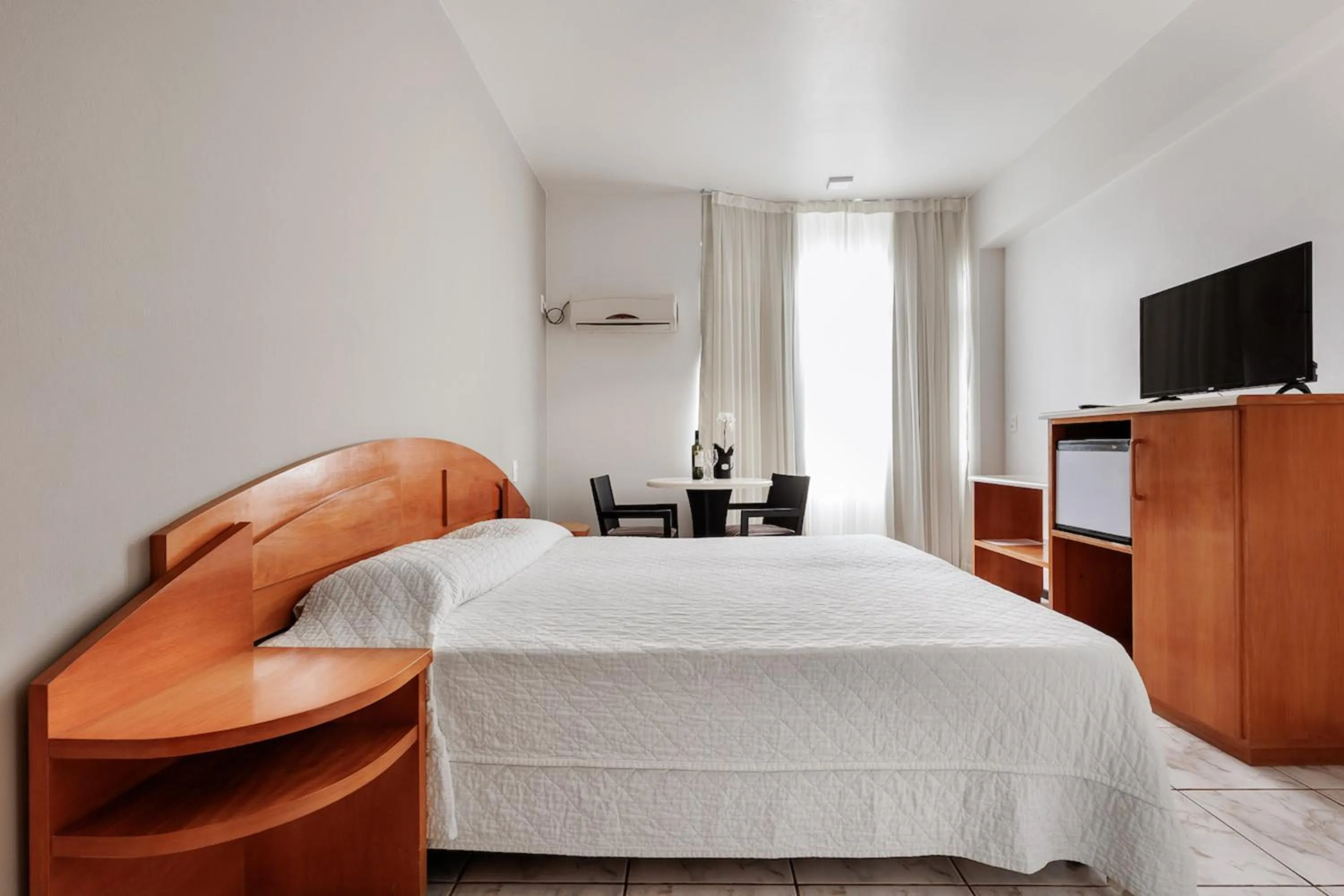 Bed in Flamboyant Hotel