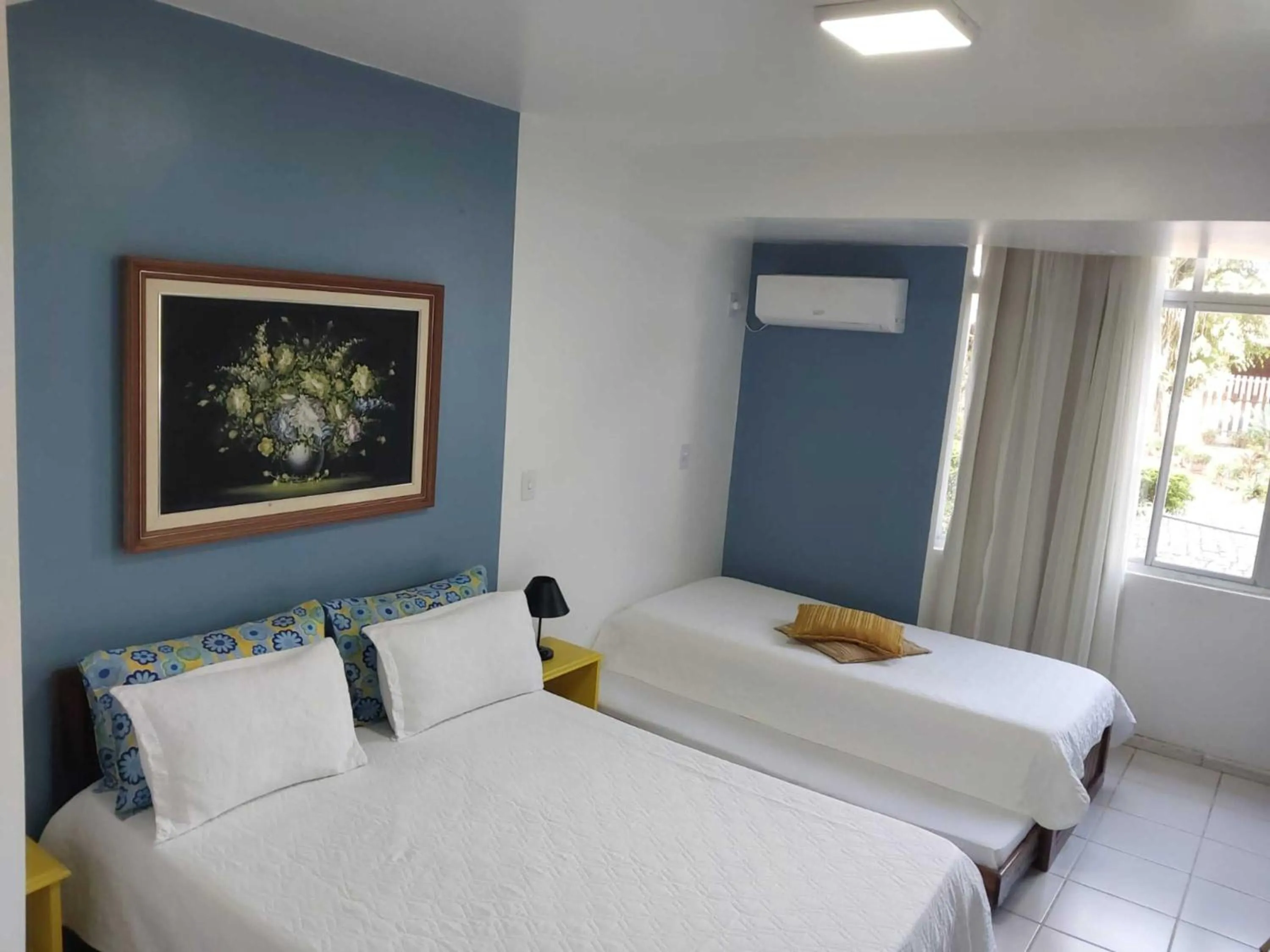 Bed in Flamboyant Hotel