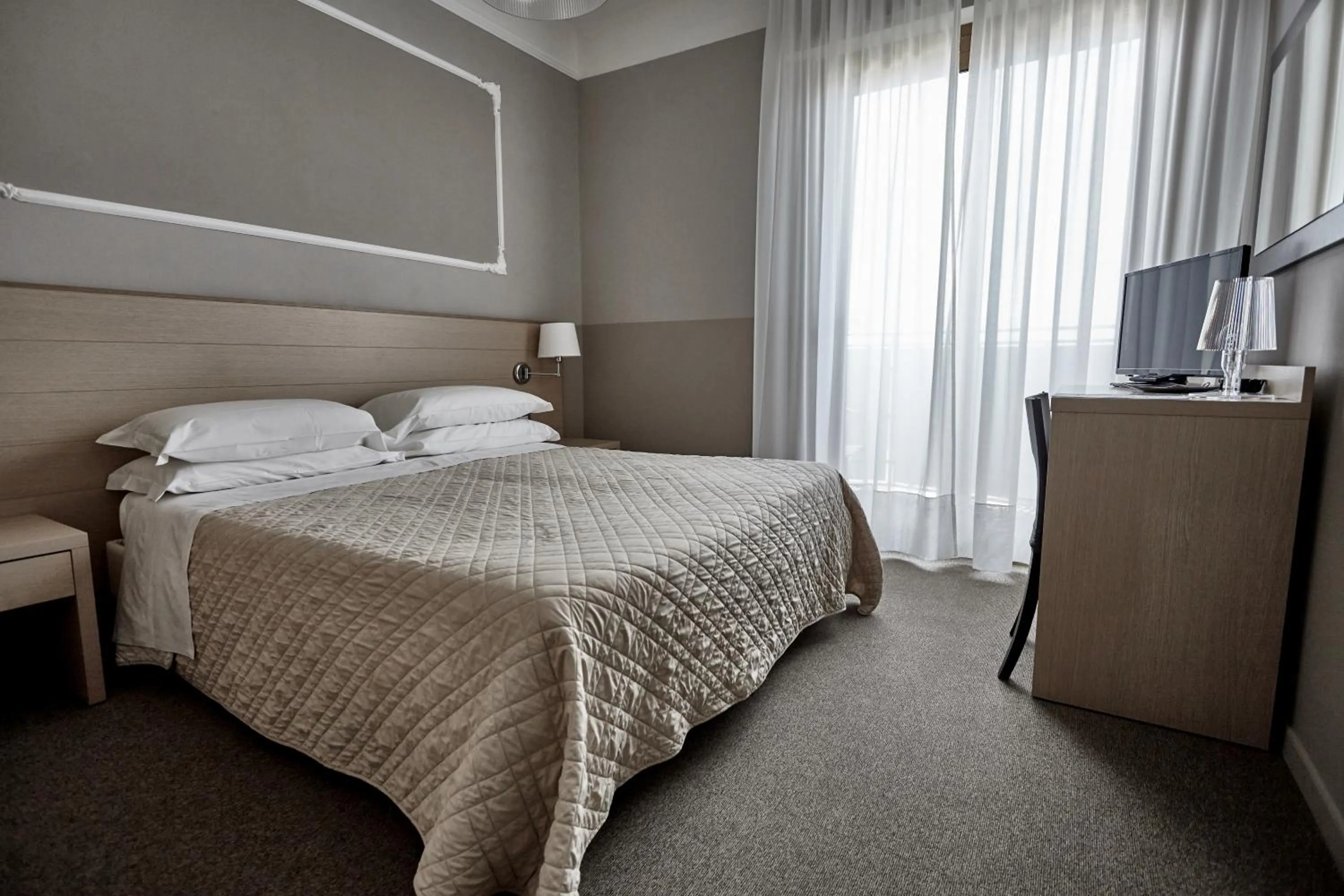 Bed in Rouge Hotel International