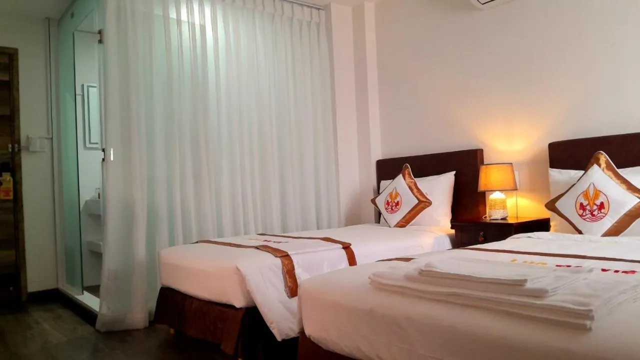 Bed in THE RICE HOTEL