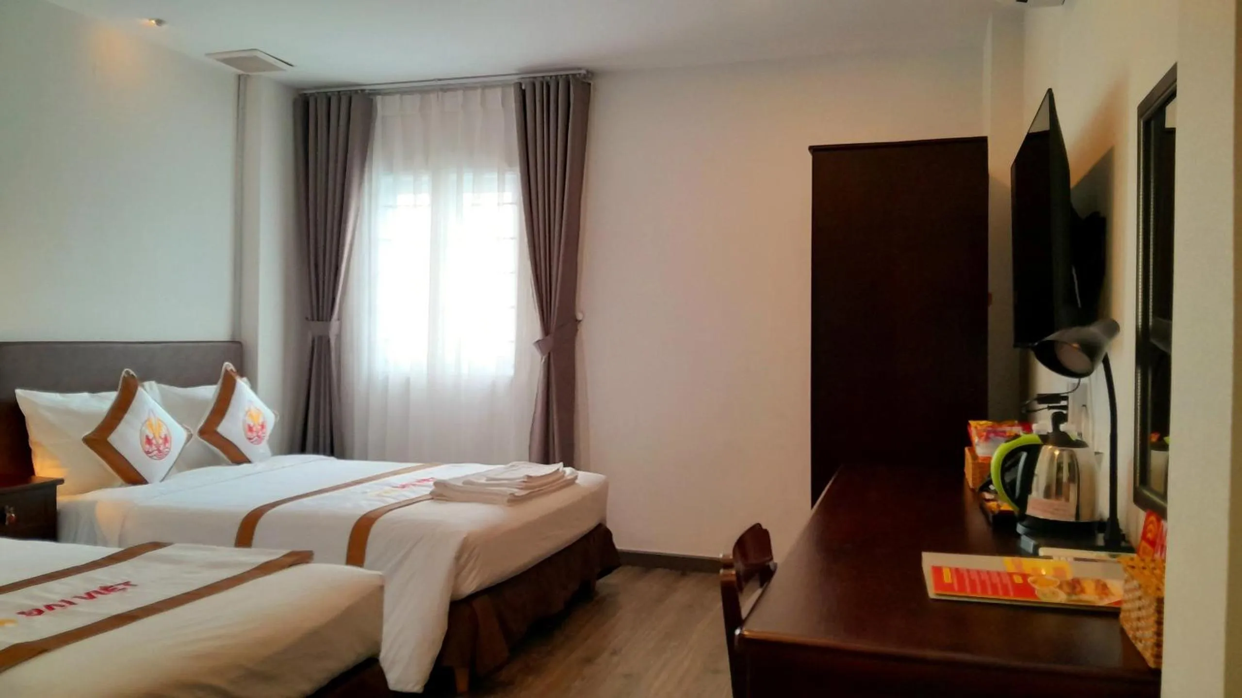 Bed in THE RICE HOTEL