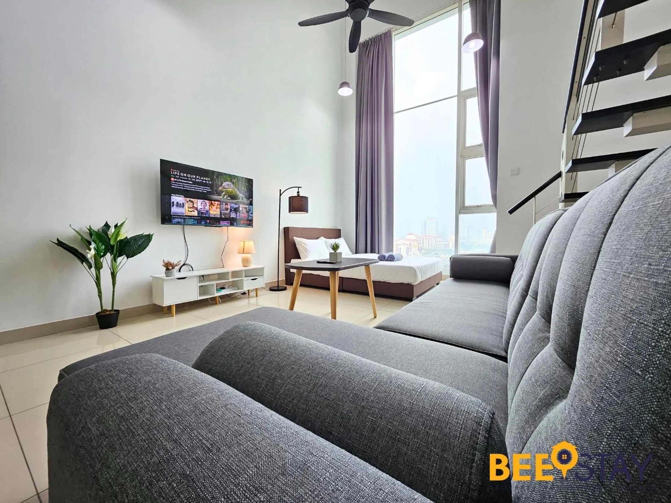 Living room in The Scott Garden Kuala Lumpur by BeeStay Management