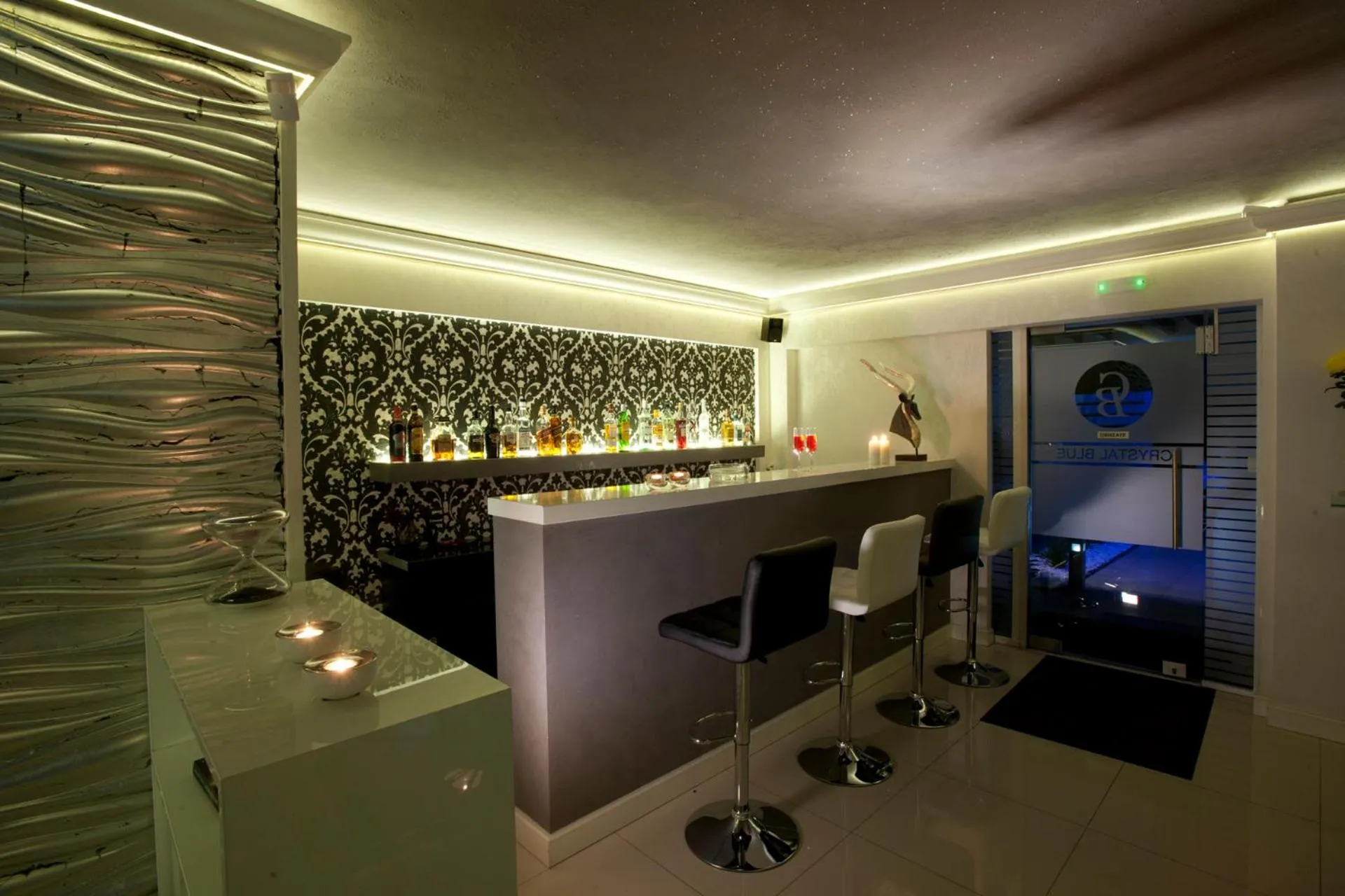 Communal lounge/ TV room in The Crystal Blue Hotel