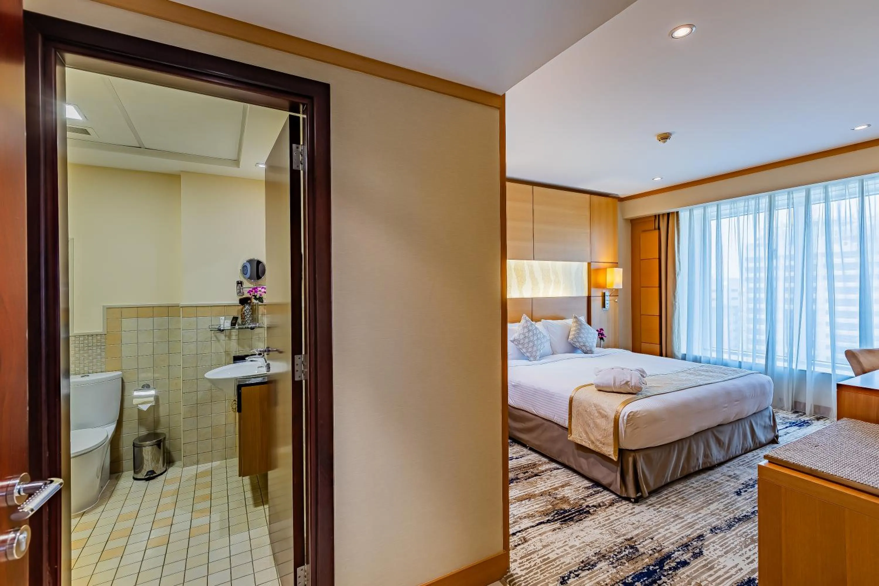 Bed in Carlton Downtown Hotel