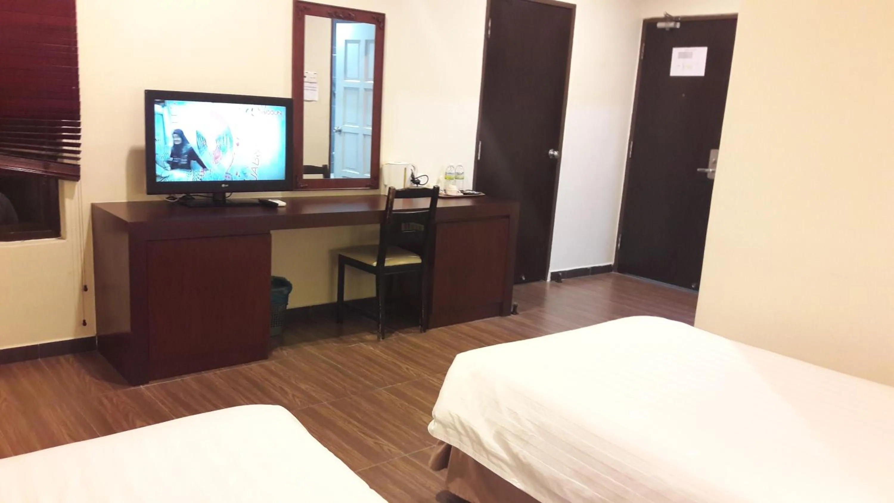 Bed in Cheng Ho Hotel