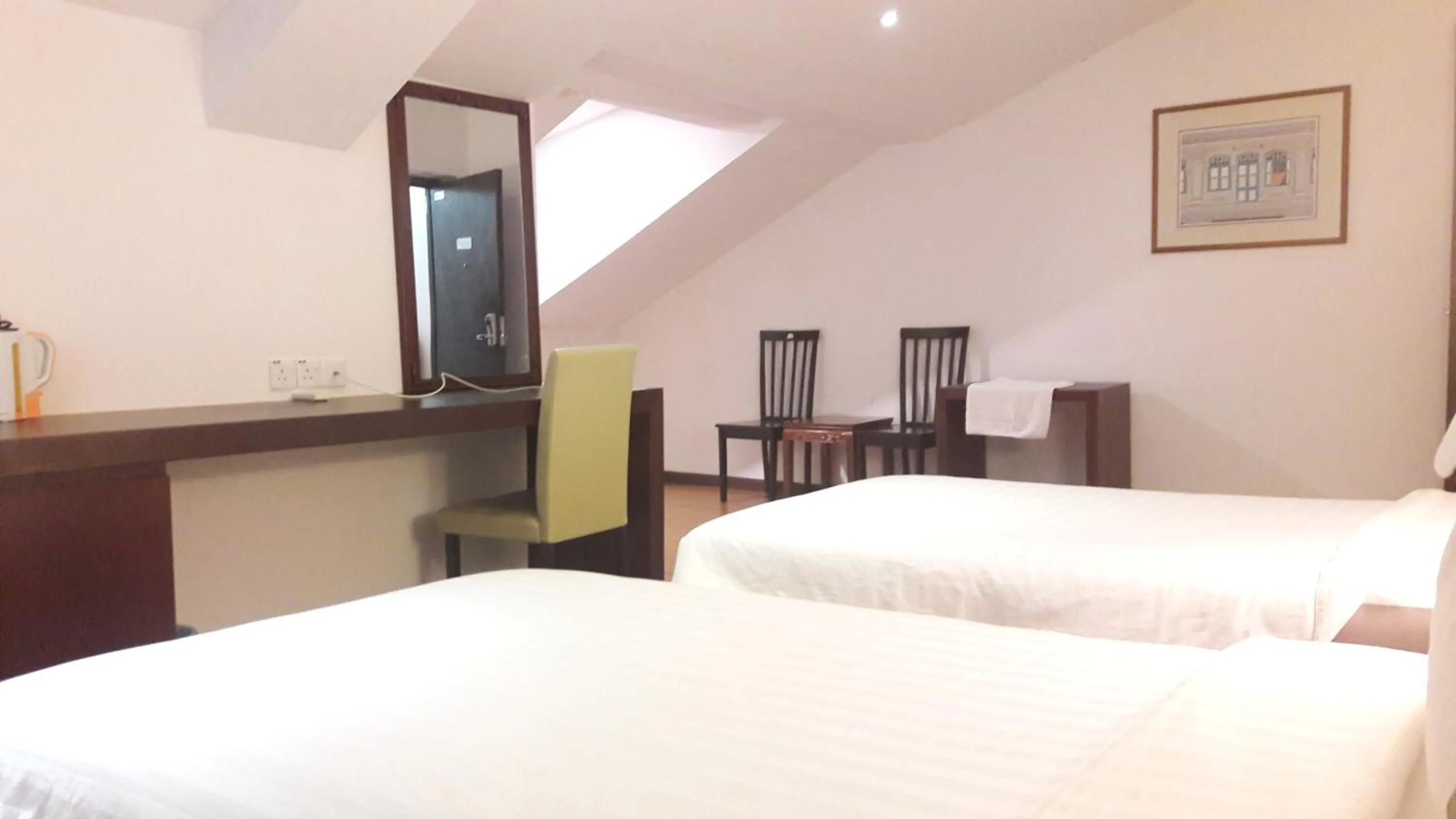 Bed in Cheng Ho Hotel