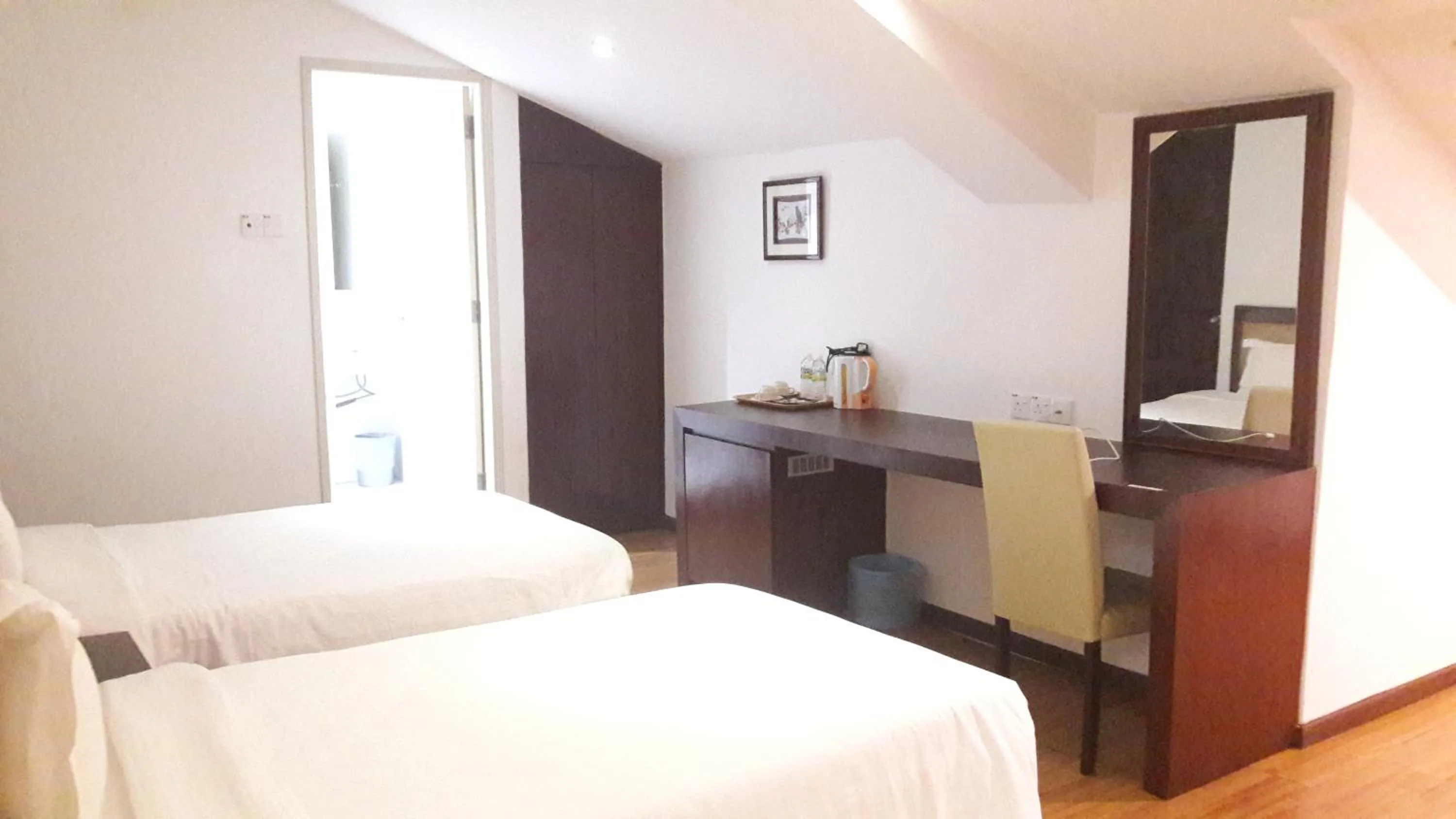 Bed in Cheng Ho Hotel