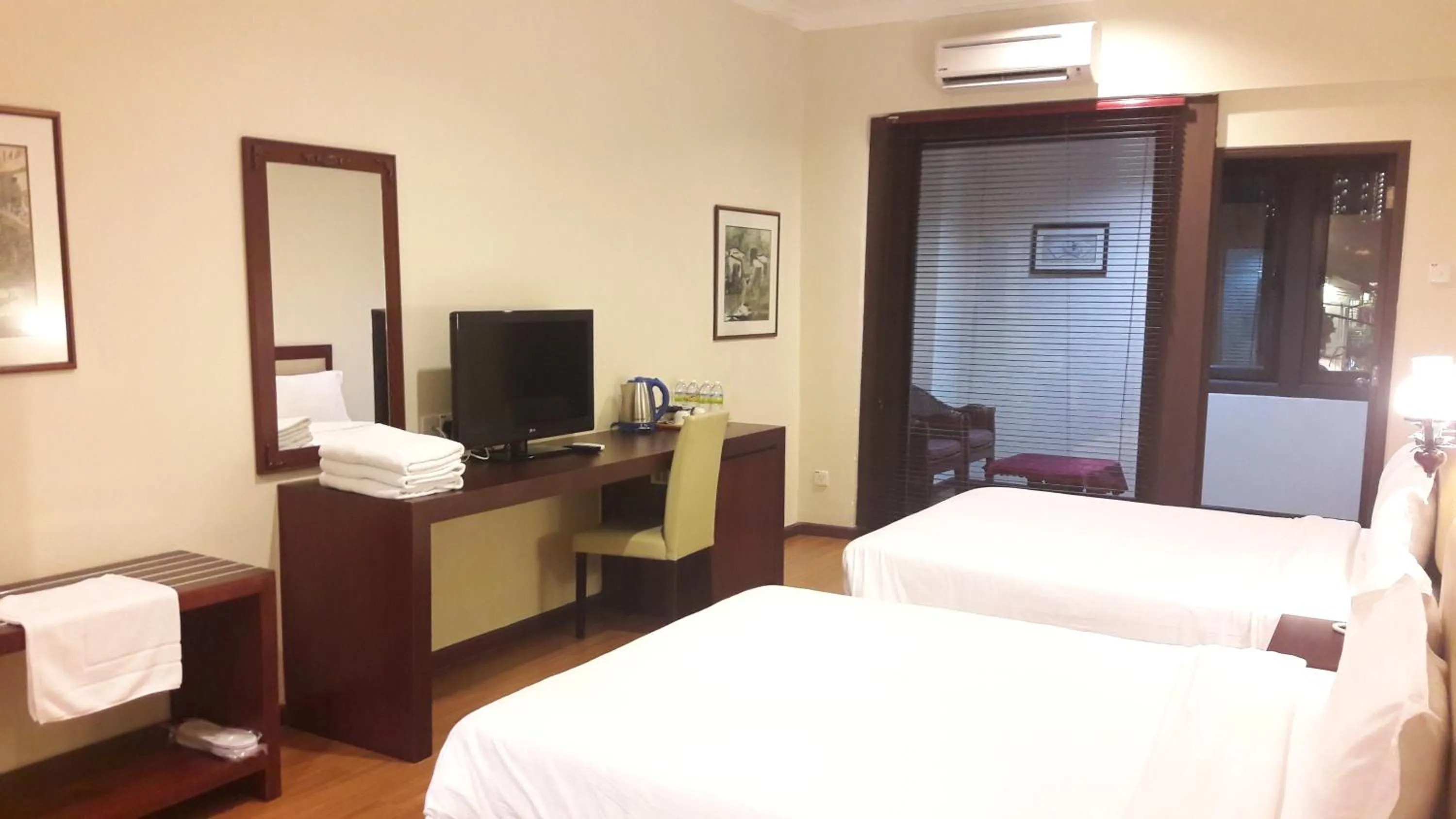 Bed in Cheng Ho Hotel