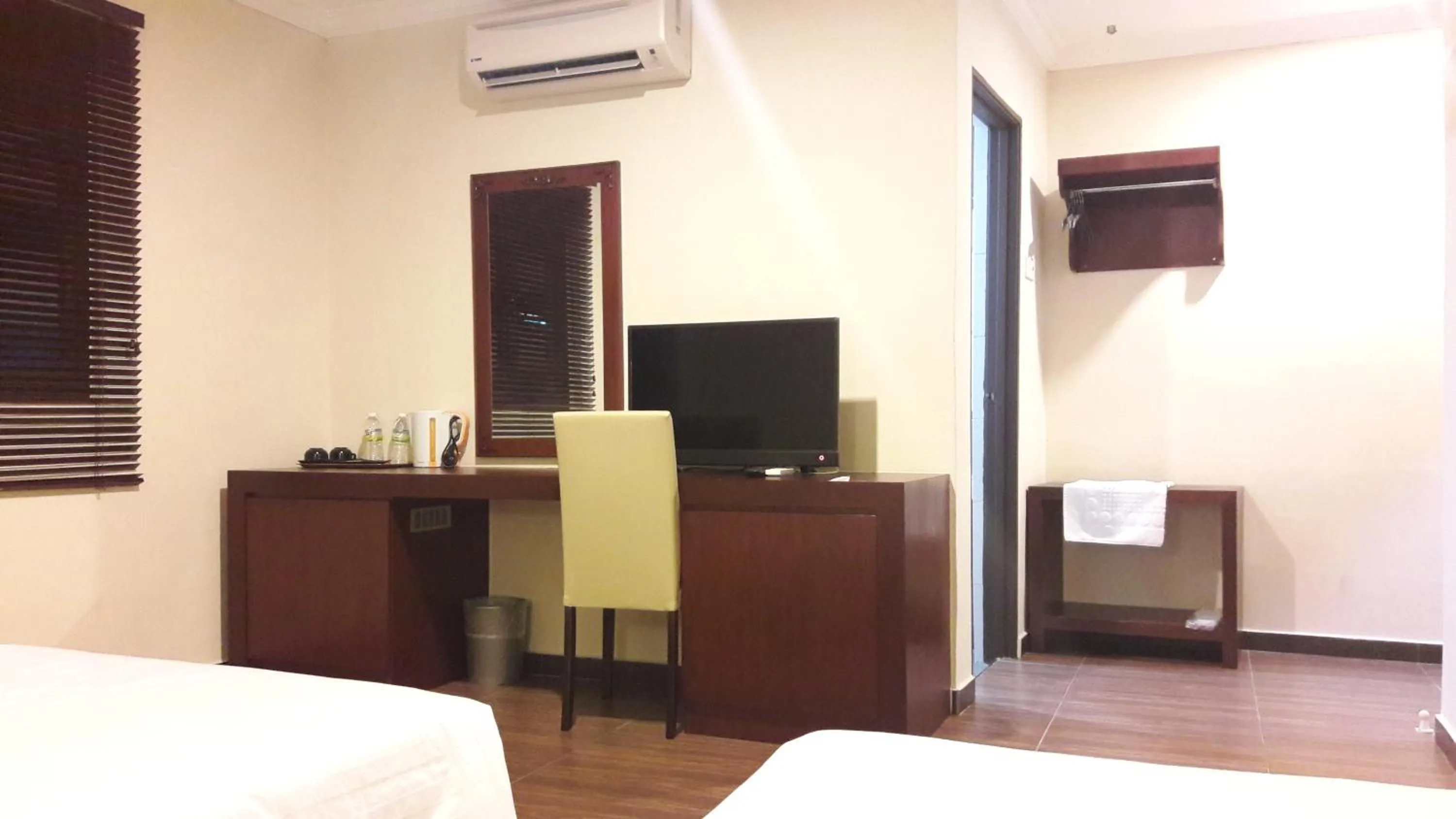 Bed in Cheng Ho Hotel