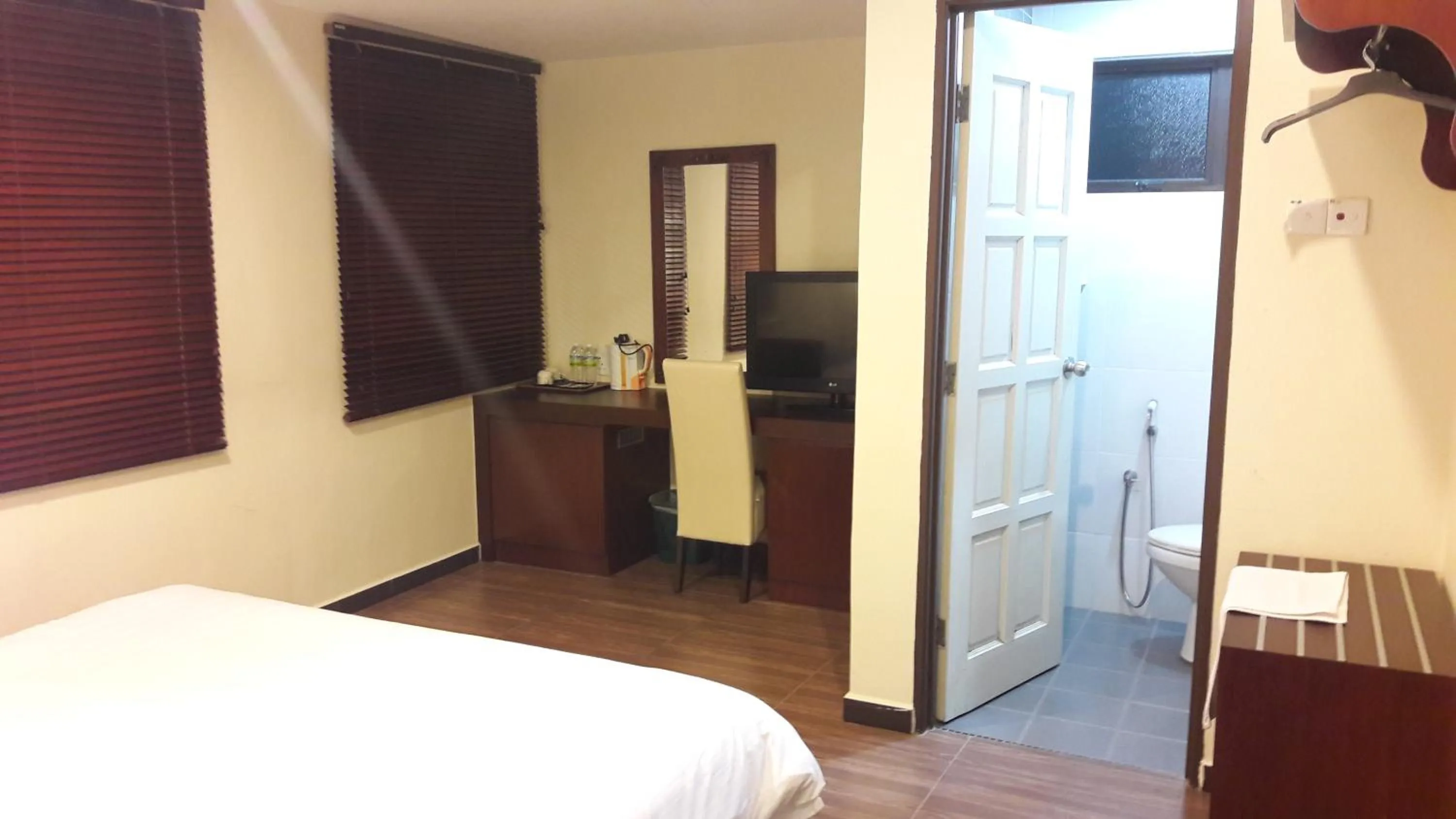 Bed in Cheng Ho Hotel