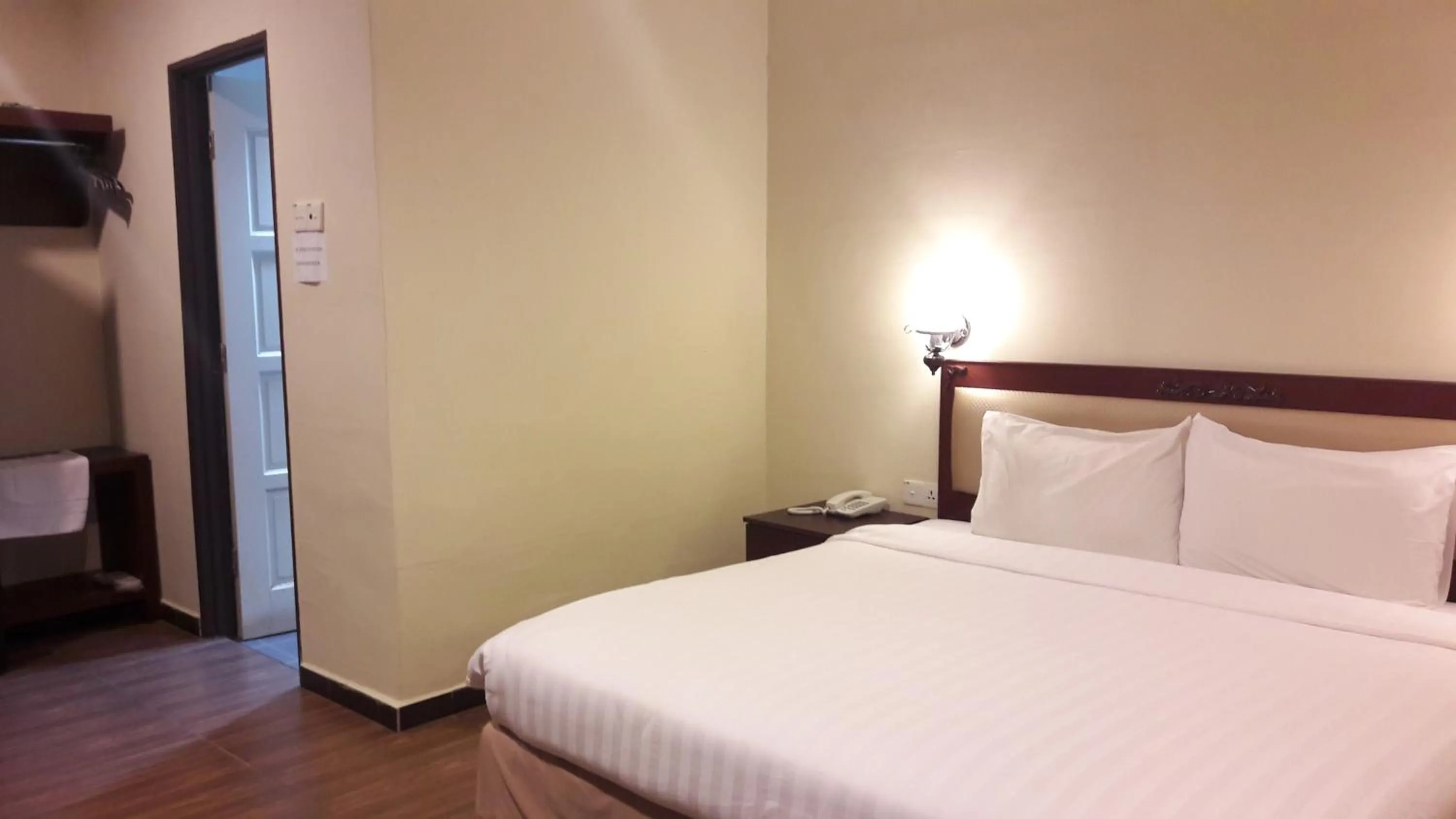 Bed in Cheng Ho Hotel