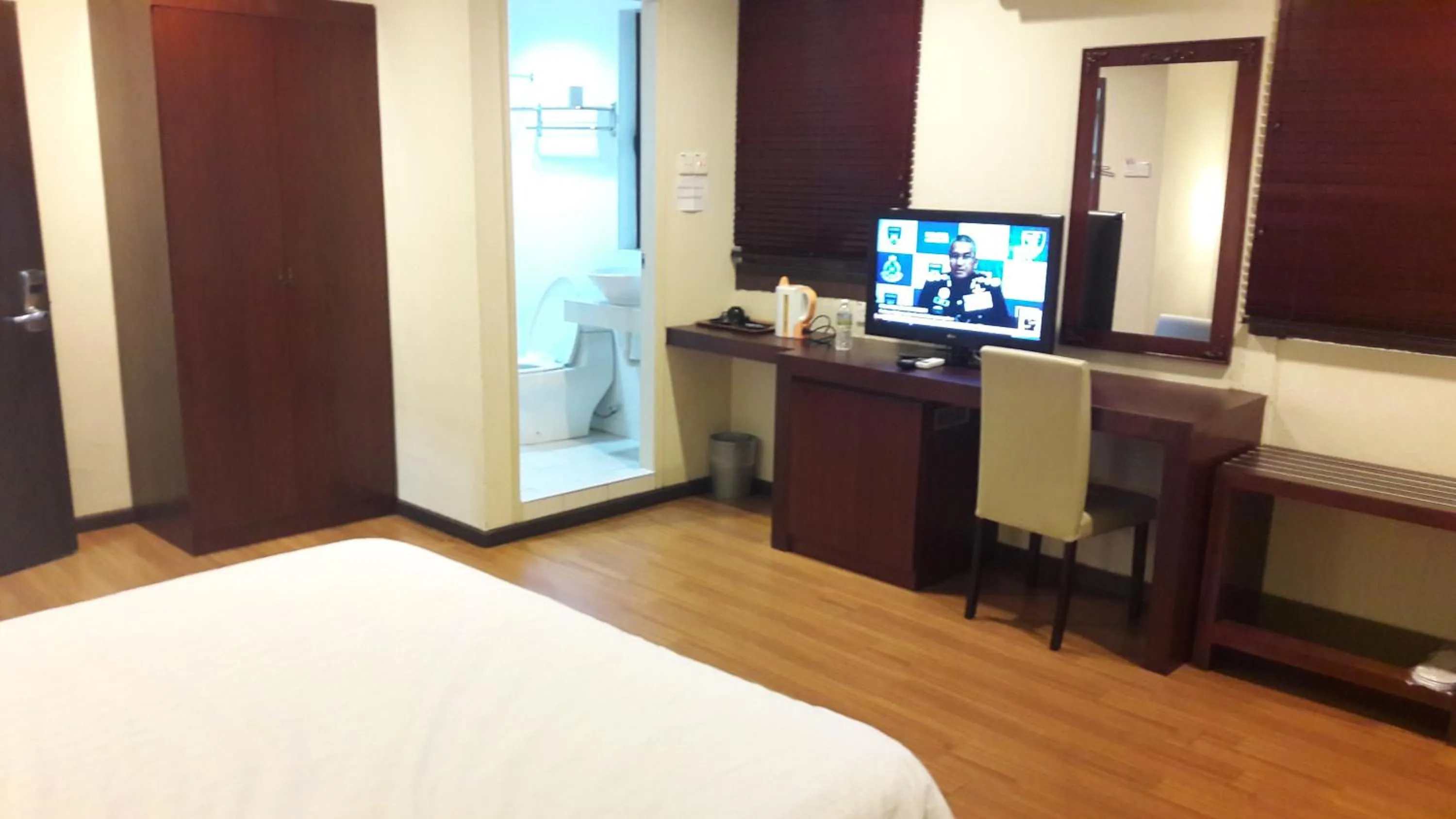 Bed in Cheng Ho Hotel