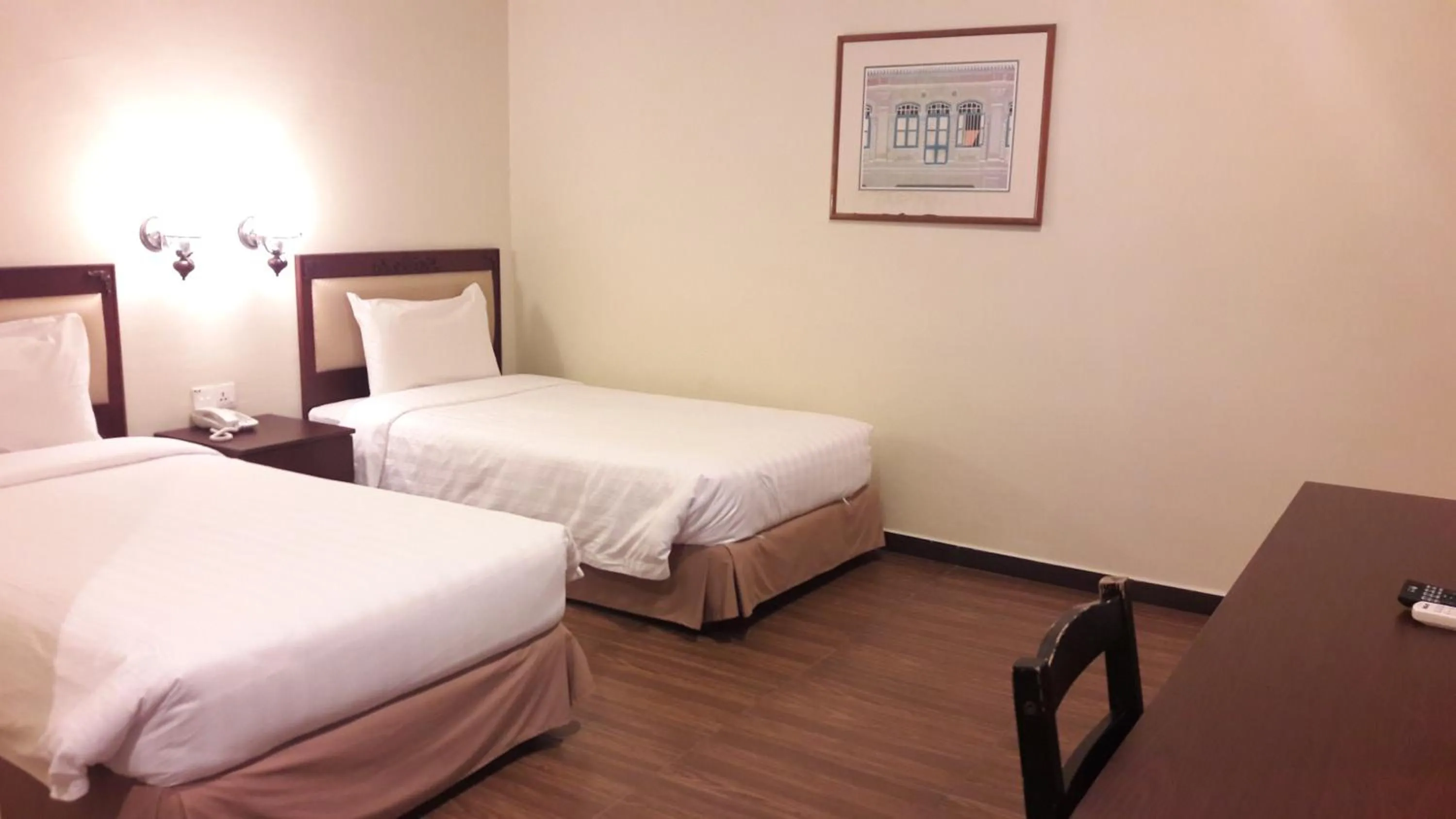 Bed in Cheng Ho Hotel