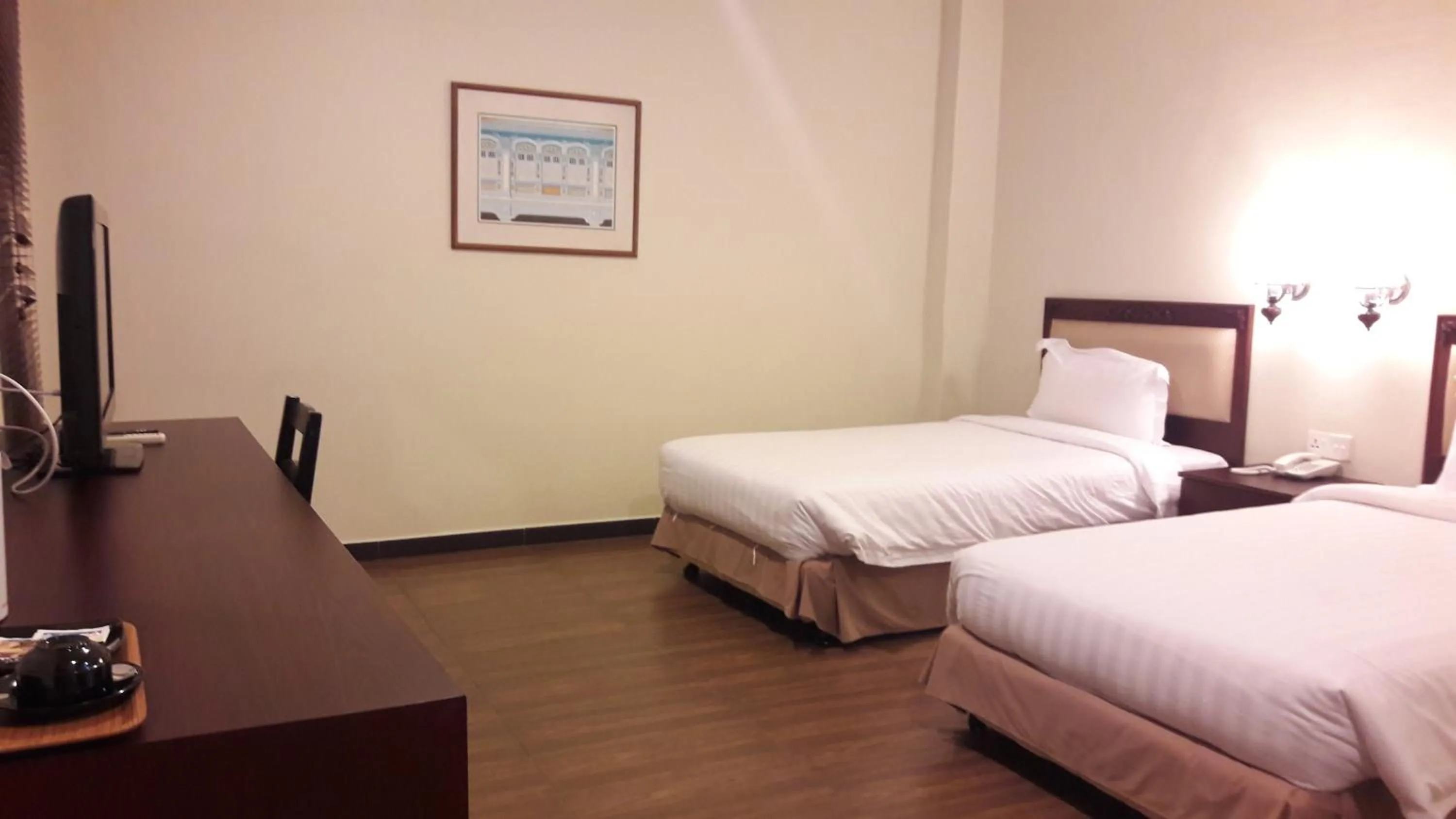 Bed in Cheng Ho Hotel