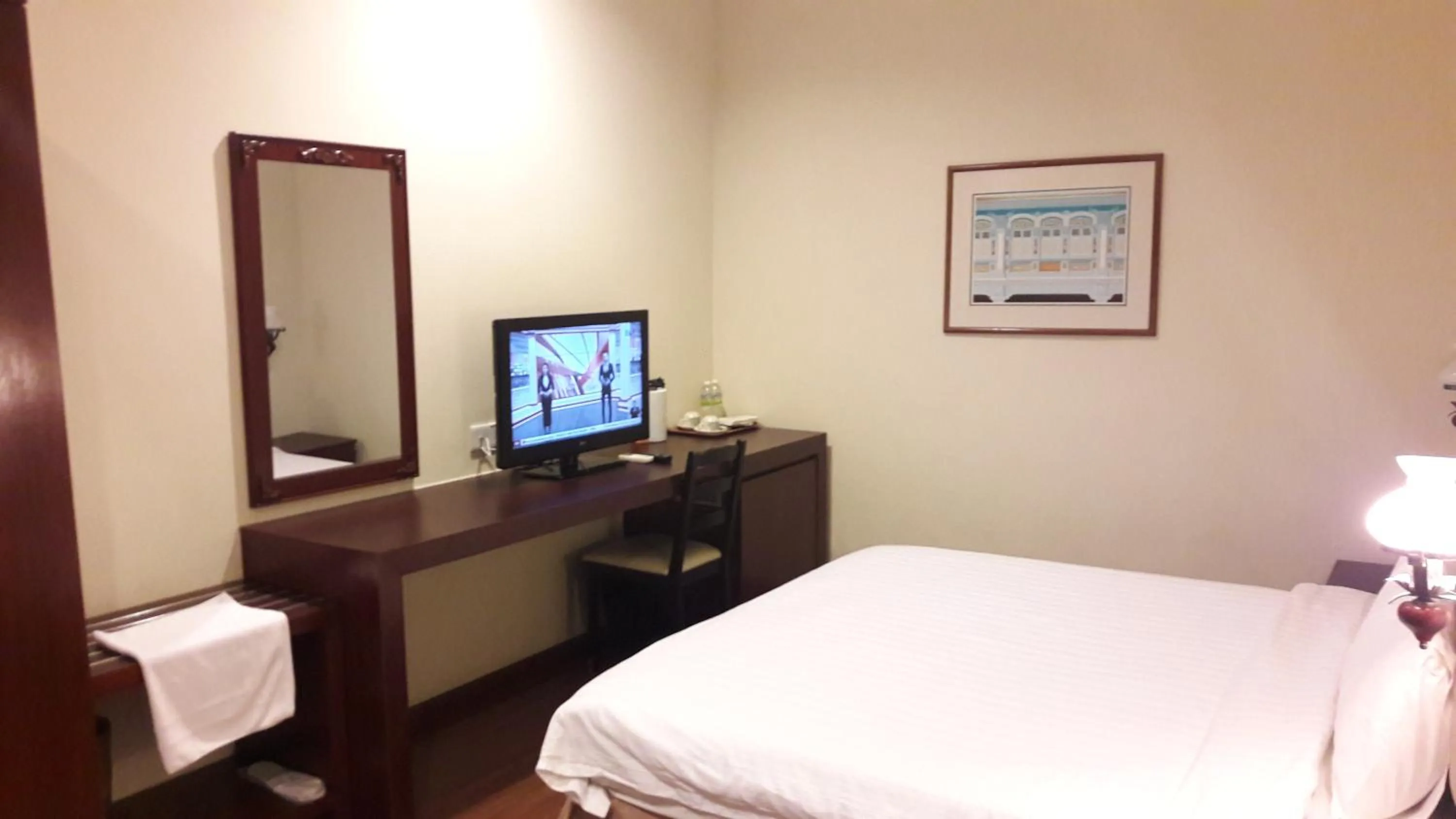 Bed in Cheng Ho Hotel