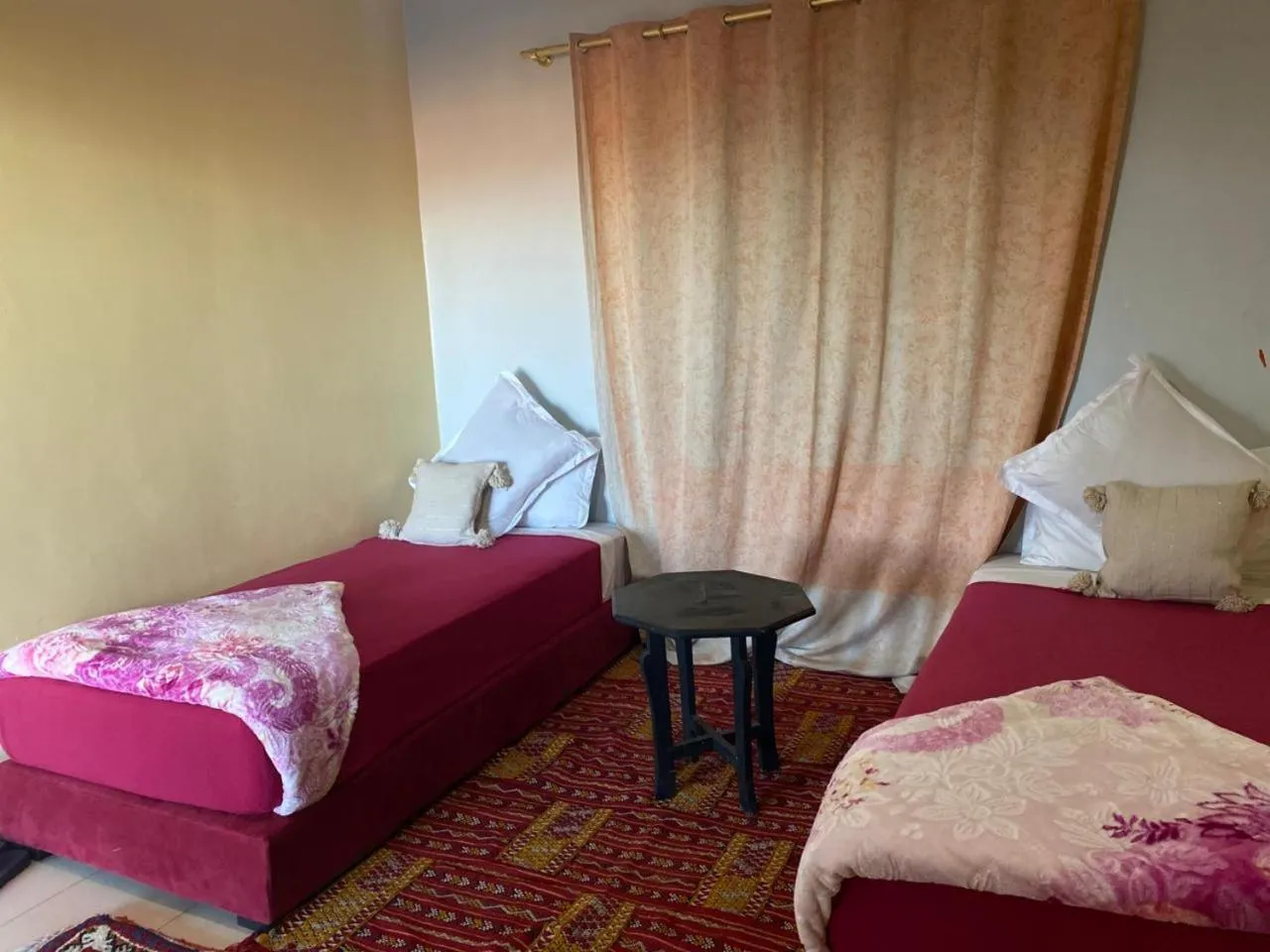 Bed in APPART AIGLE HOTEL