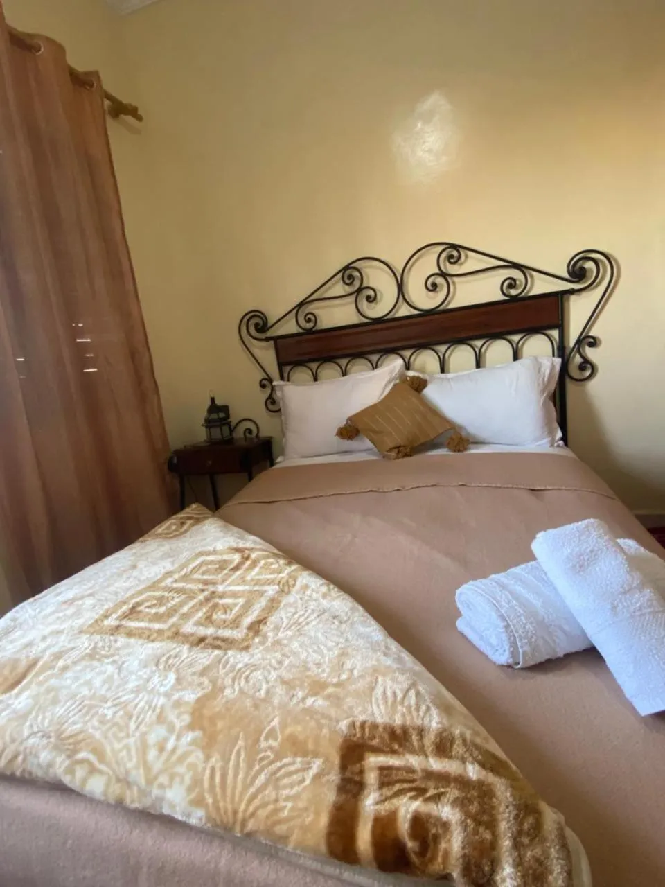 Bed in APPART AIGLE HOTEL