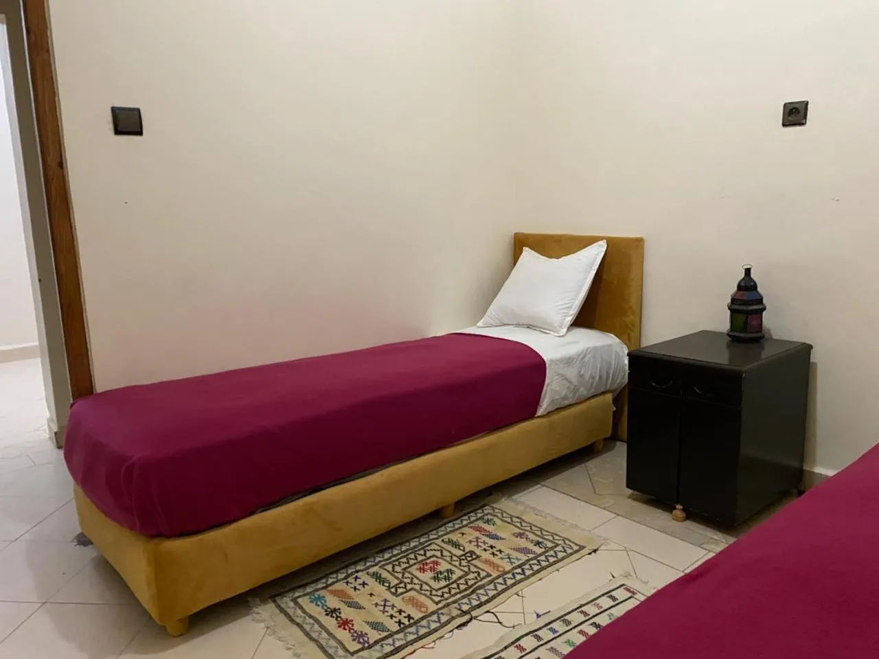 Bed in APPART AIGLE HOTEL