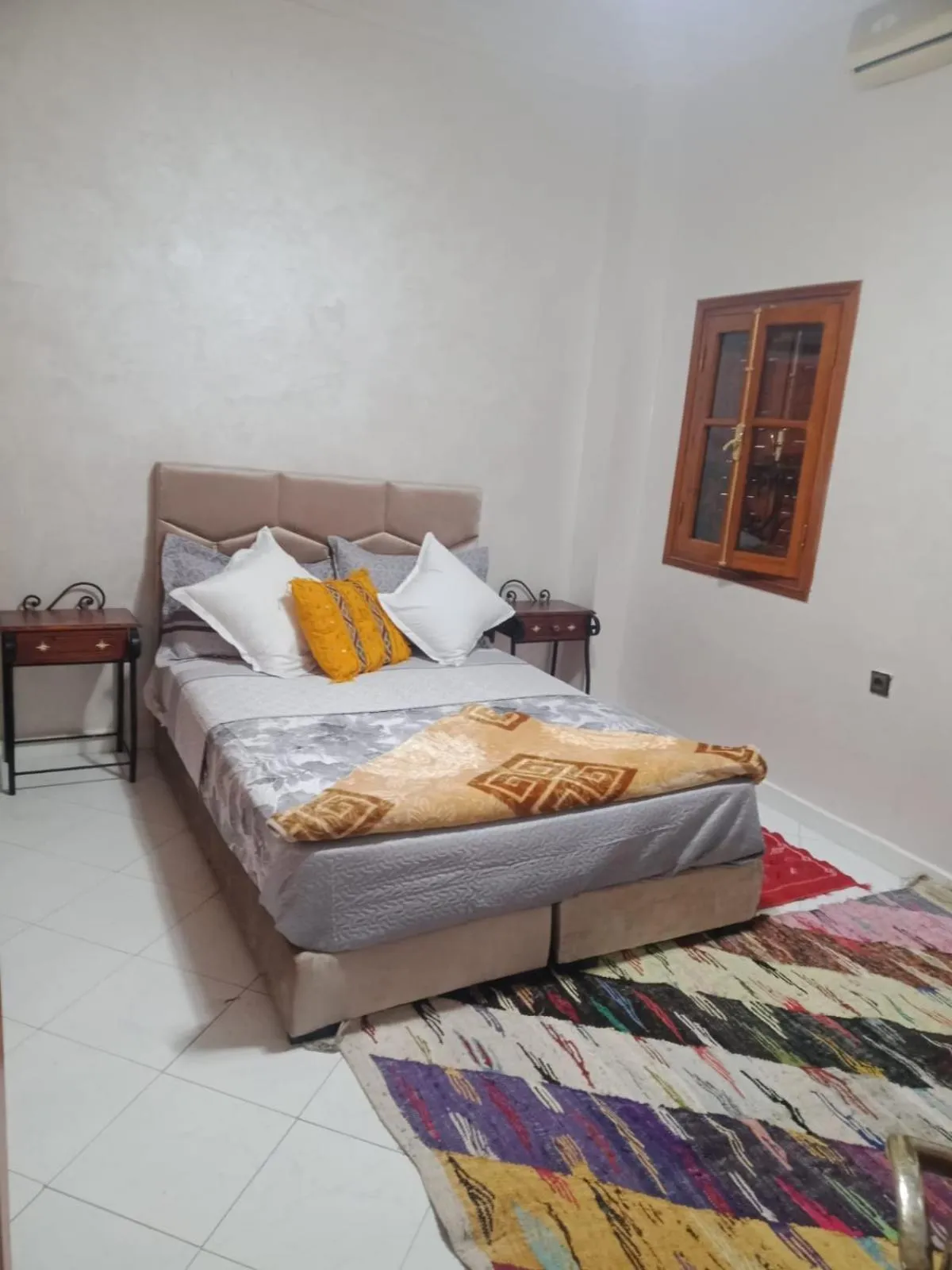 Bed in APPART AIGLE HOTEL