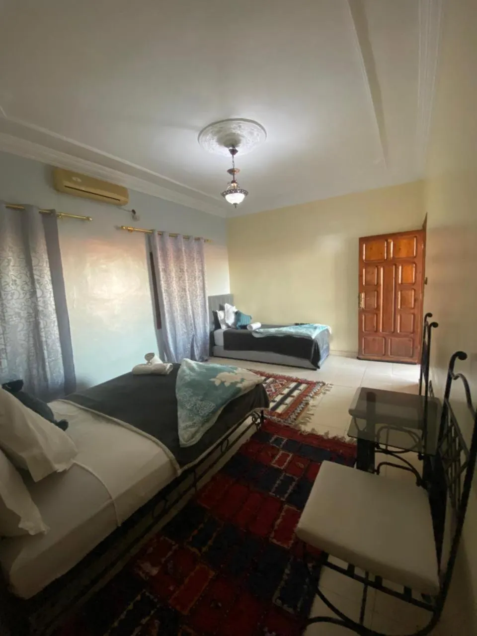 Bed in APPART AIGLE HOTEL