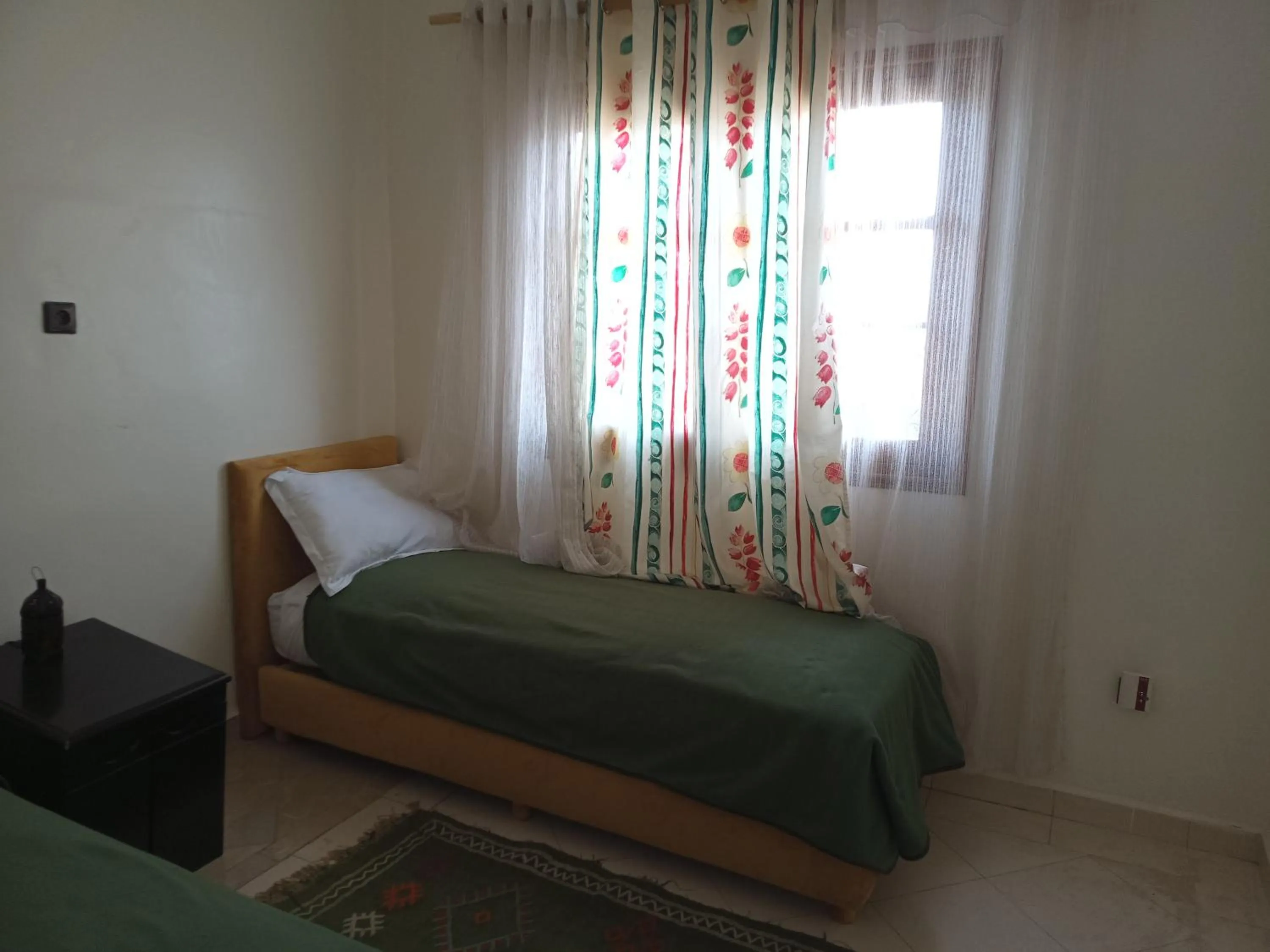 Bed in APPART AIGLE HOTEL