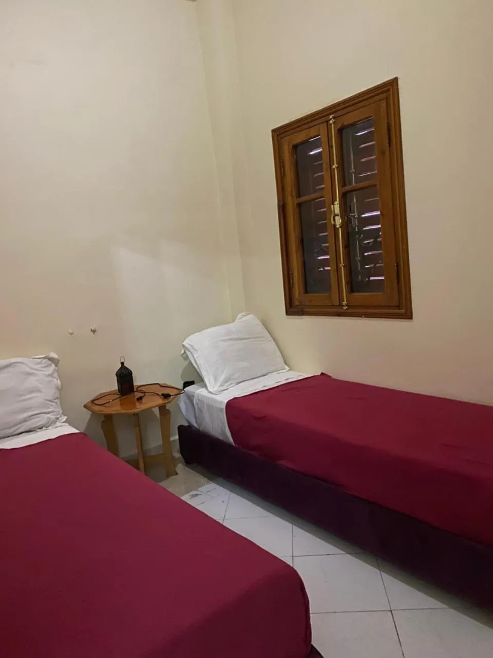 Bed in APPART AIGLE HOTEL