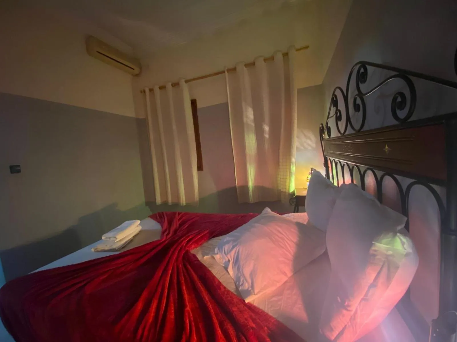 Bed in APPART AIGLE HOTEL