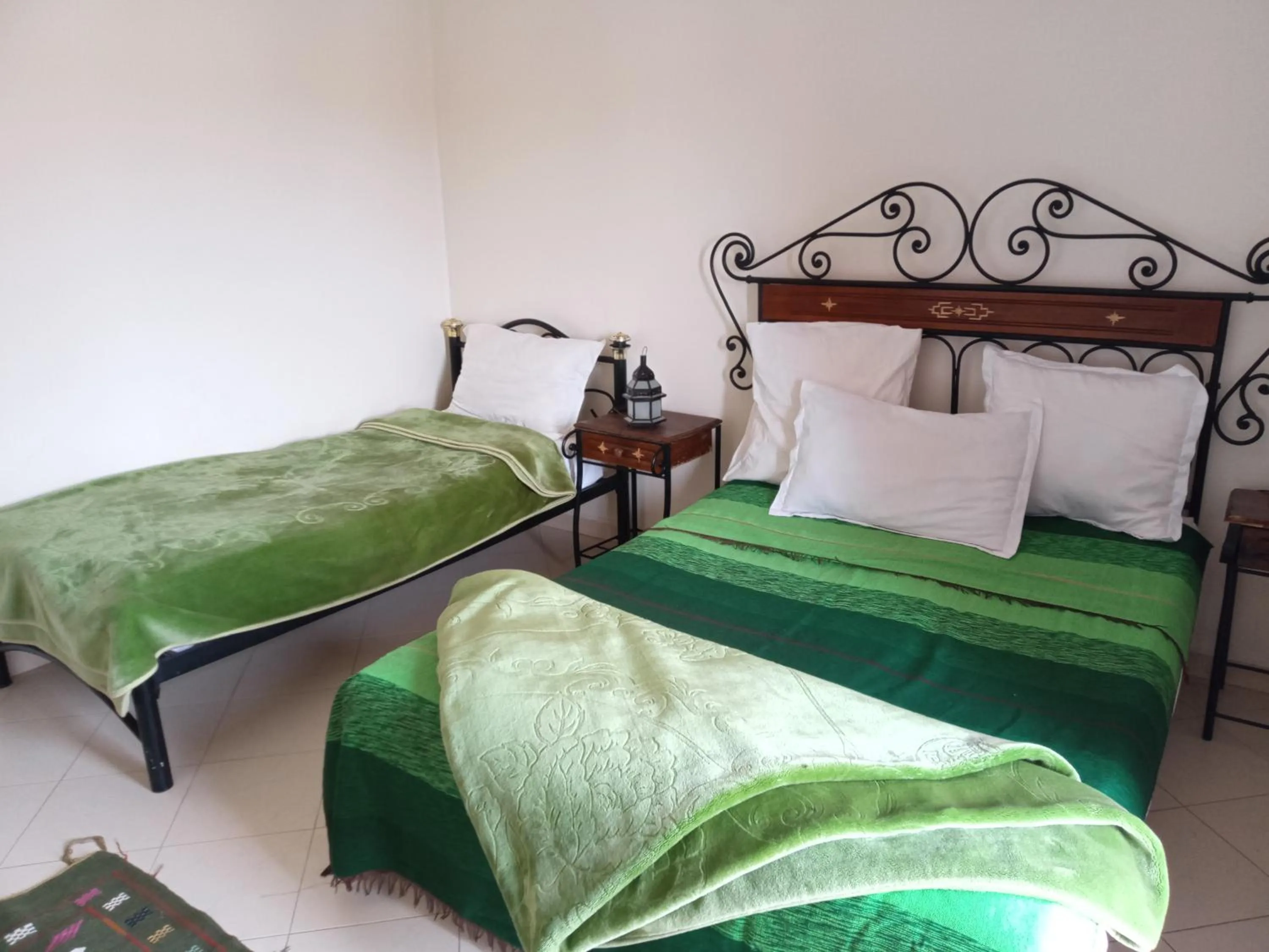 Bed in APPART AIGLE HOTEL