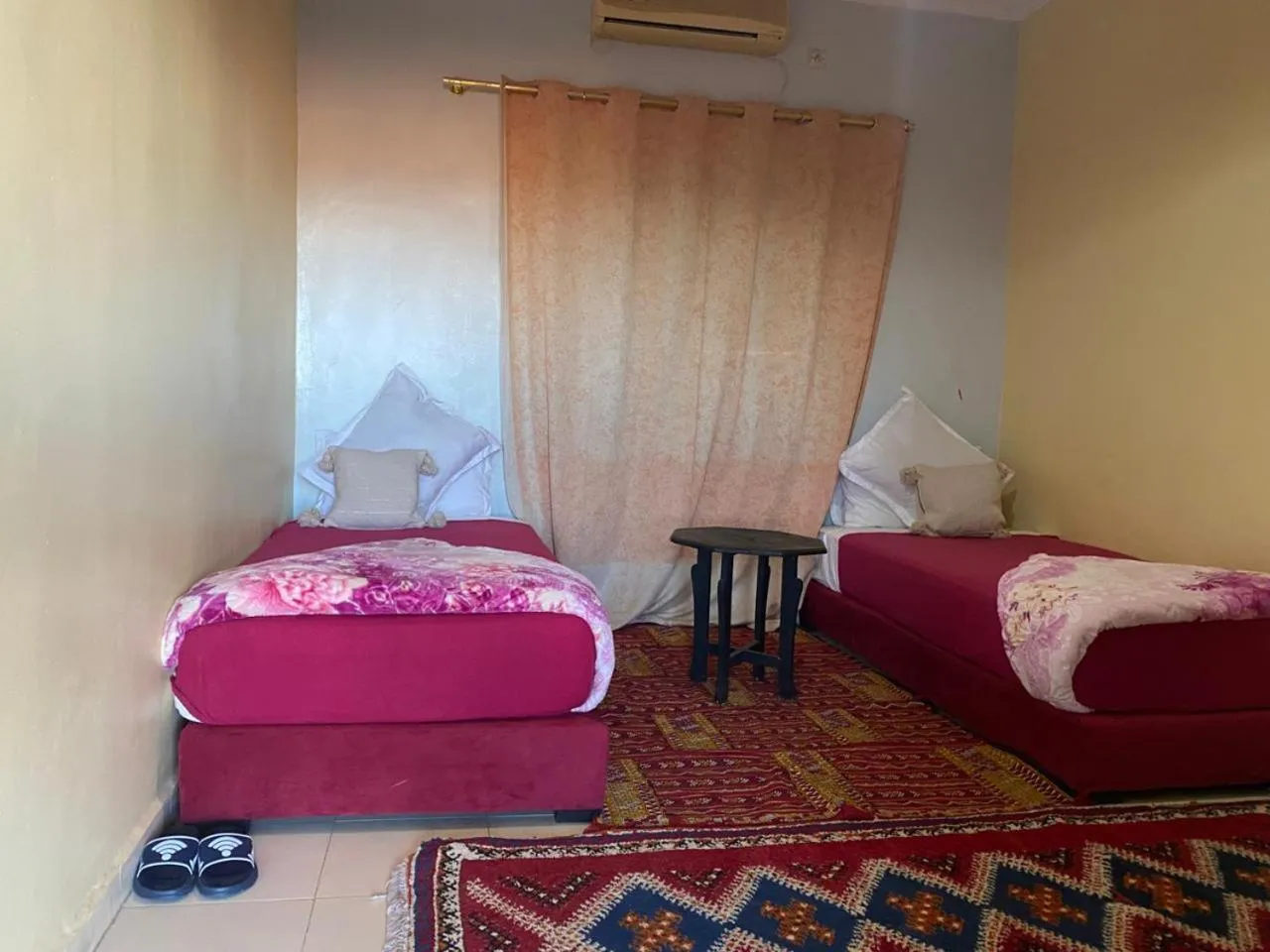 Bed in APPART AIGLE HOTEL