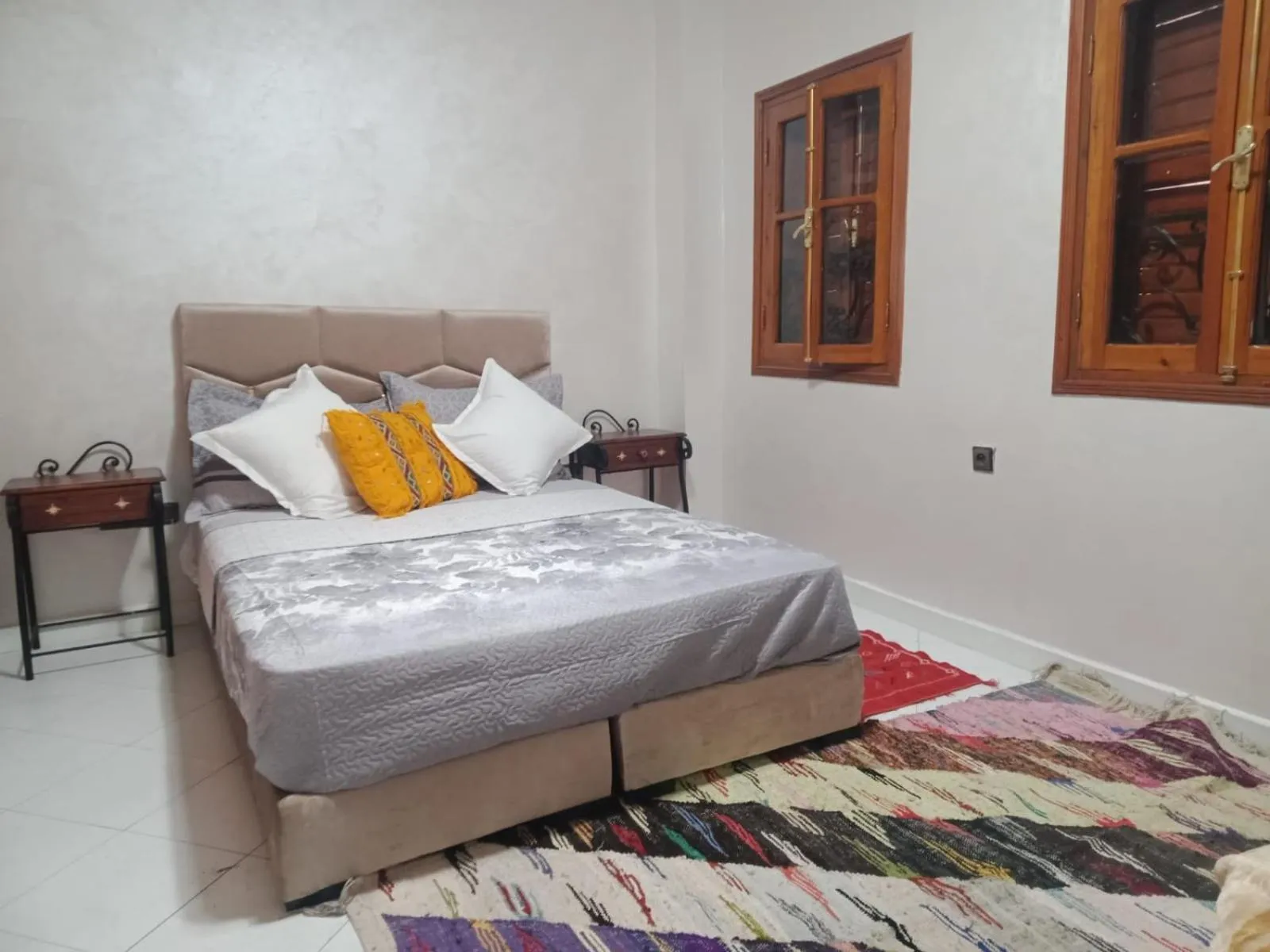 Bed in APPART AIGLE HOTEL