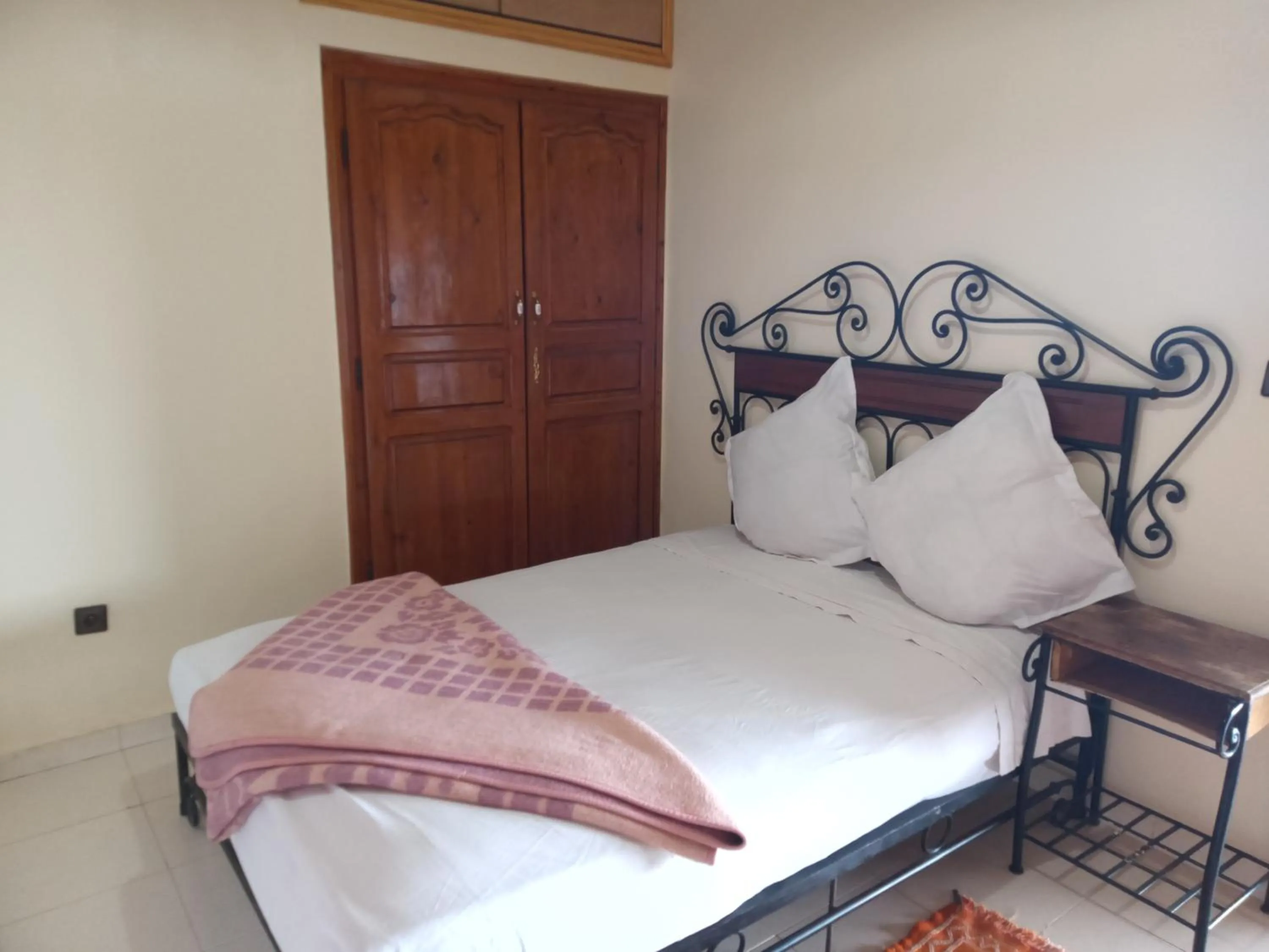 Bed in APPART AIGLE HOTEL