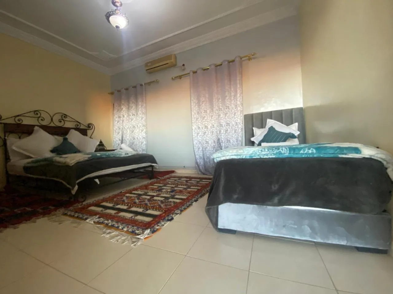 Bed in APPART AIGLE HOTEL