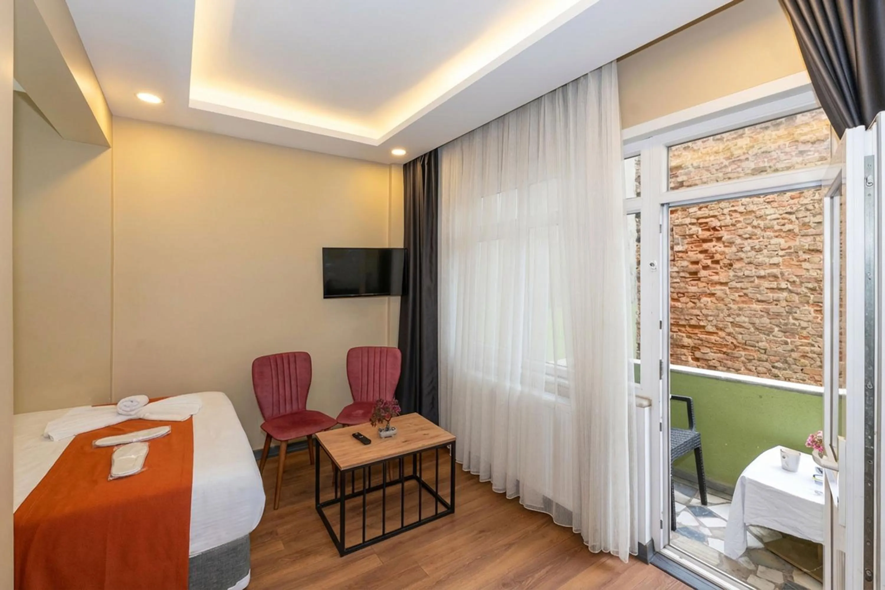 Living room, Bed in hotel La Vitrine