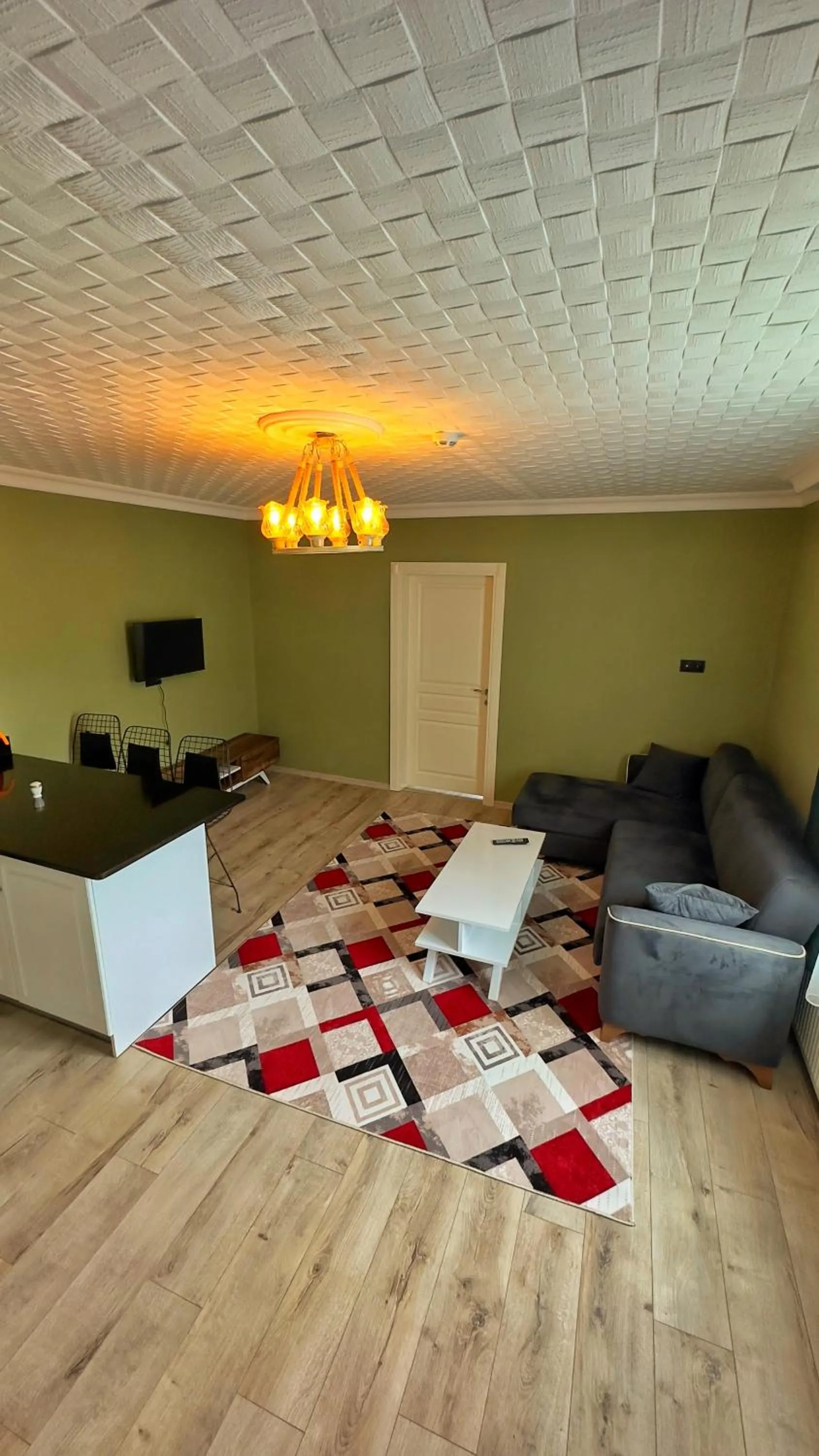 Communal lounge/ TV room in Kalispera Apart Otel