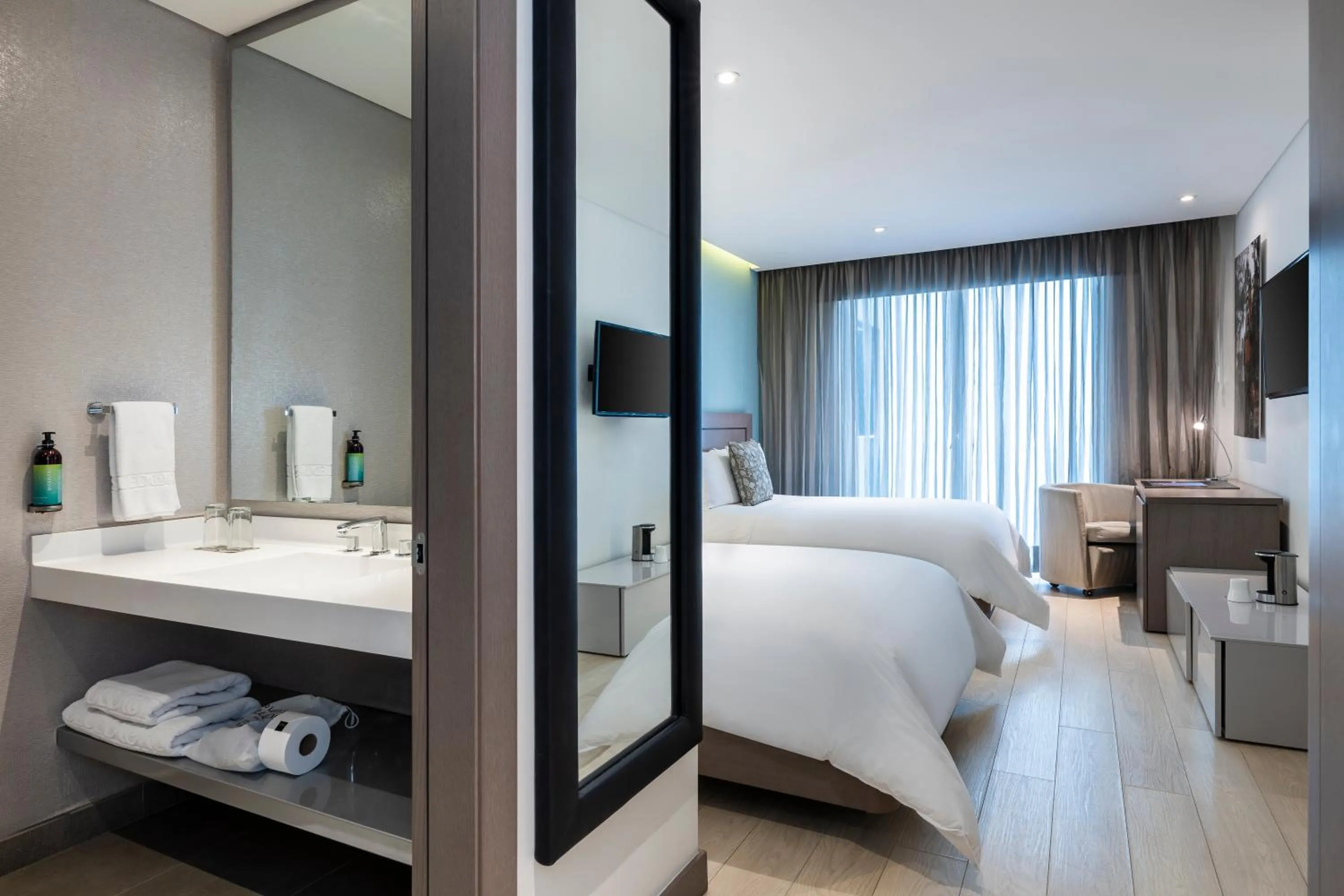 Bed in Hotel 100 Luxury Suites by Preferred