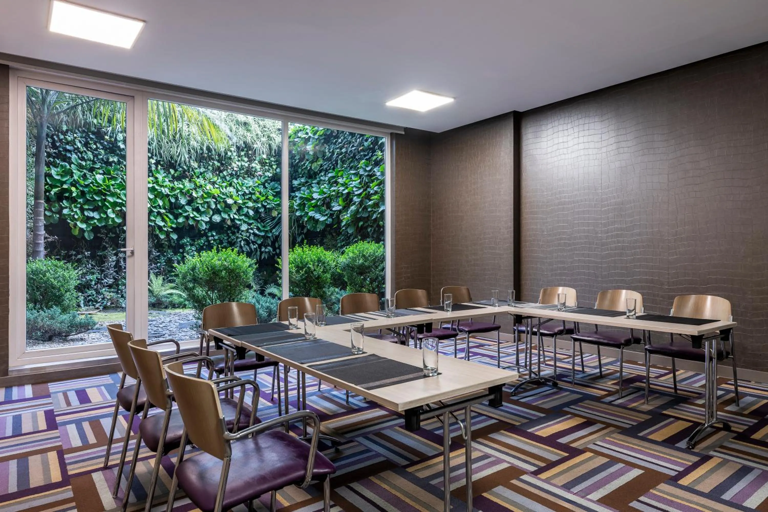 Meeting/conference room in Hotel 100 Luxury Suites by Preferred